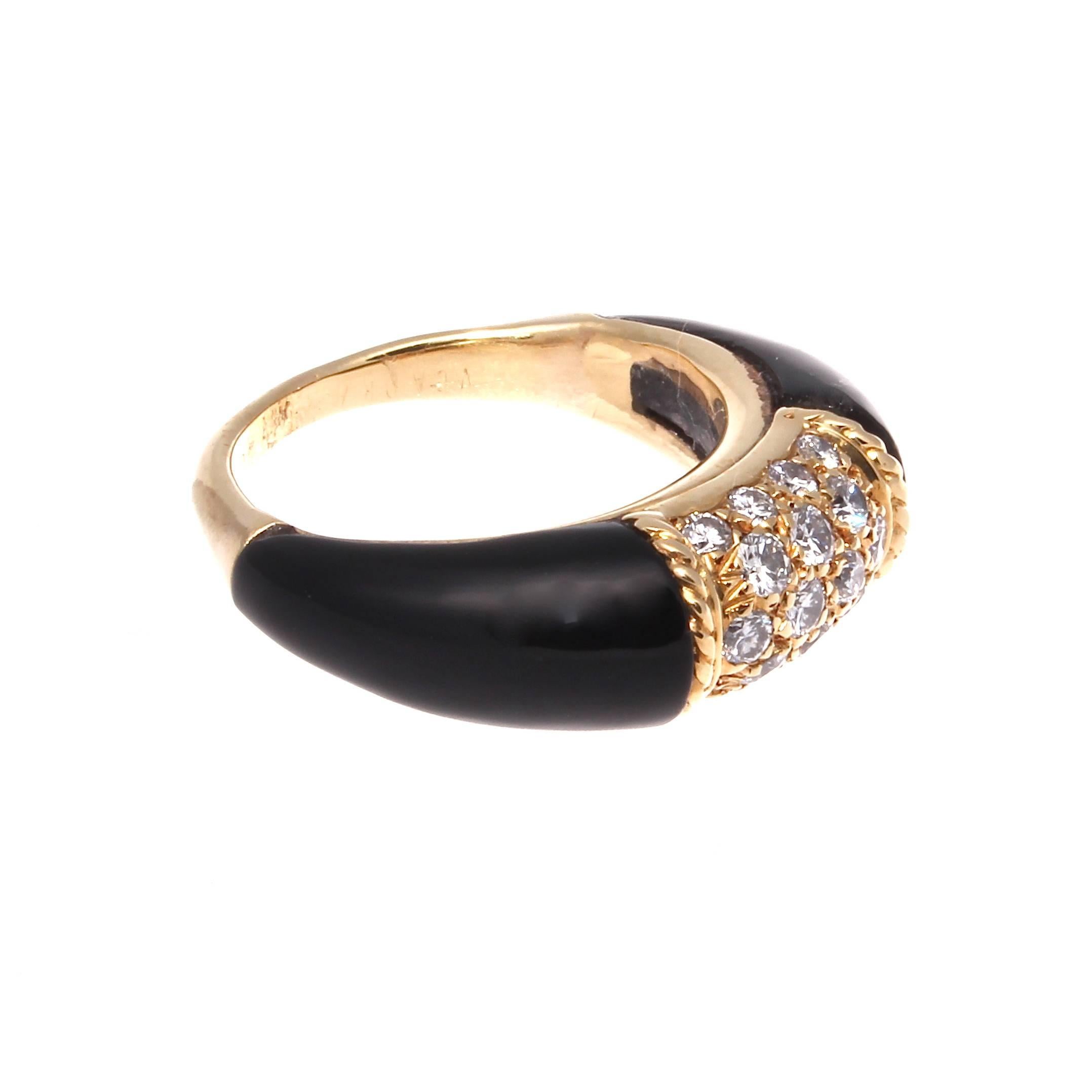 Van Cleef & Arpels, a long rich history of trend setting fashion that is still relevant today. Fashioned with sleek black onyx and numerous near colorless diamonds that are all brought together by the 18k yellow gold. Signed VCA and