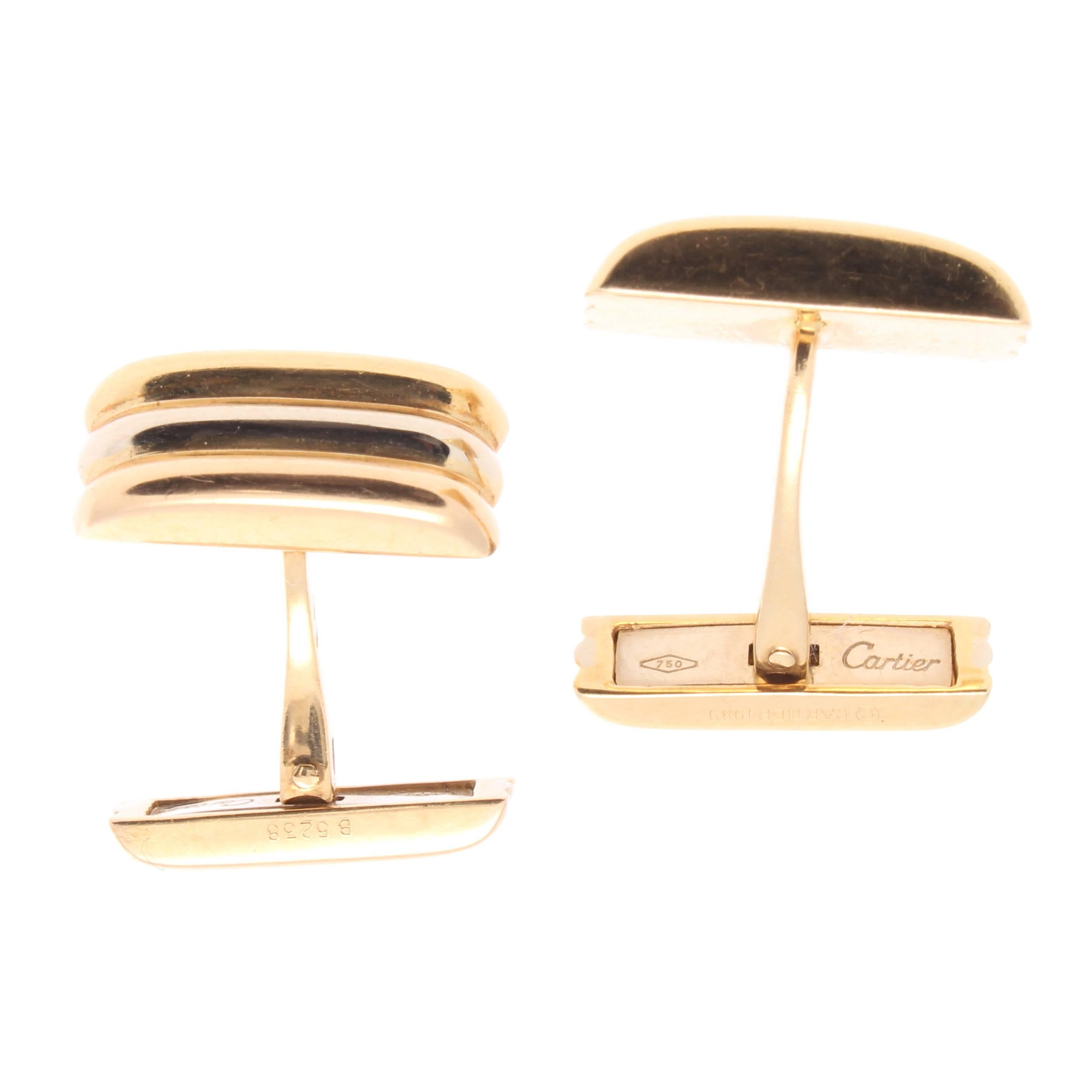 Cartier, elegant and timeless. The cufflinks have been designed in the classic use of tricolor 18k gold; pink for love, yellow for fidelity and white for friendship. Signed Cartier and numbered.
