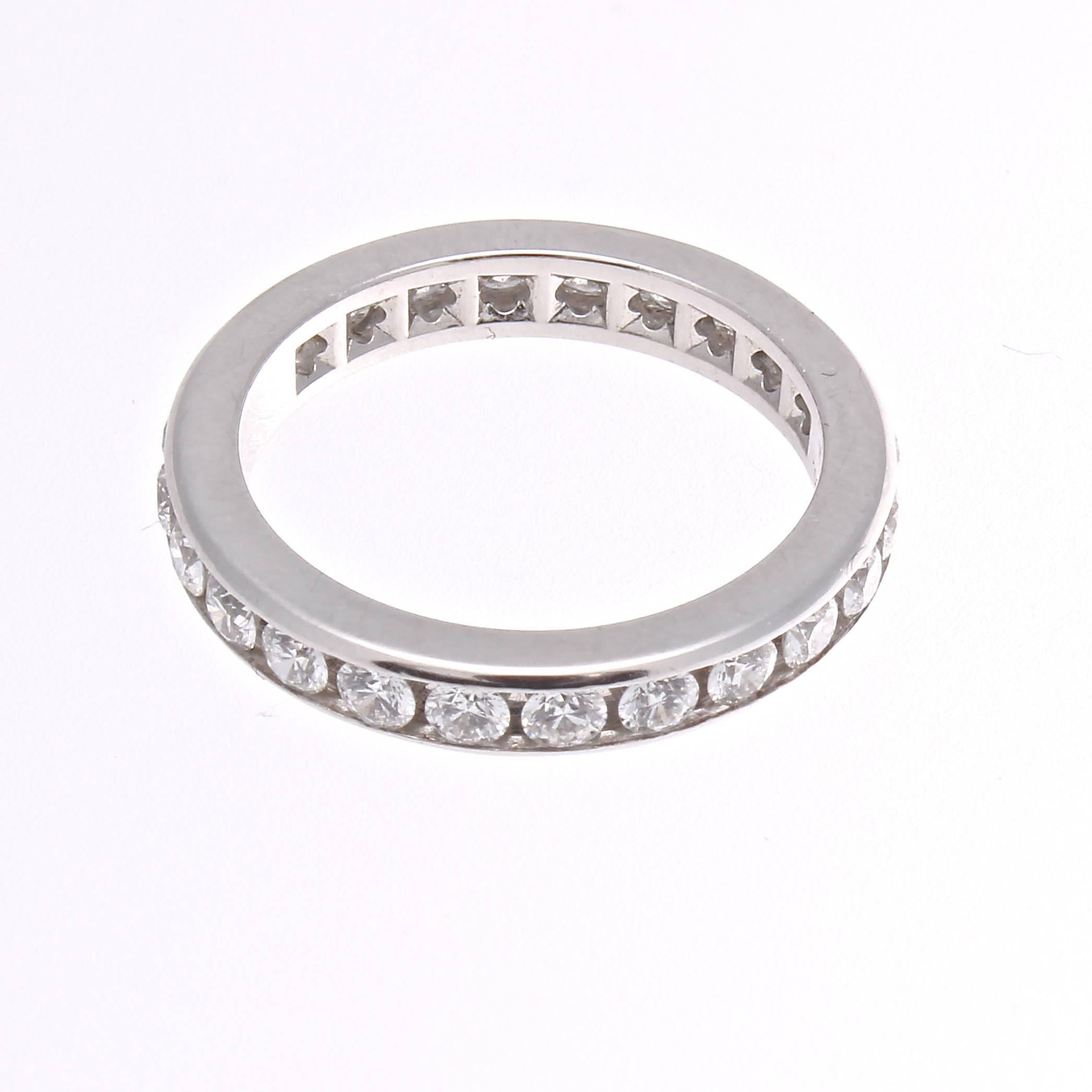 The refined taste of Tiffany is exemplified through this diamond eternity band. Featuring white, clean round cut diamonds are channel set in a platinum ring.

Ring size 4-1/2

Signed T&CO