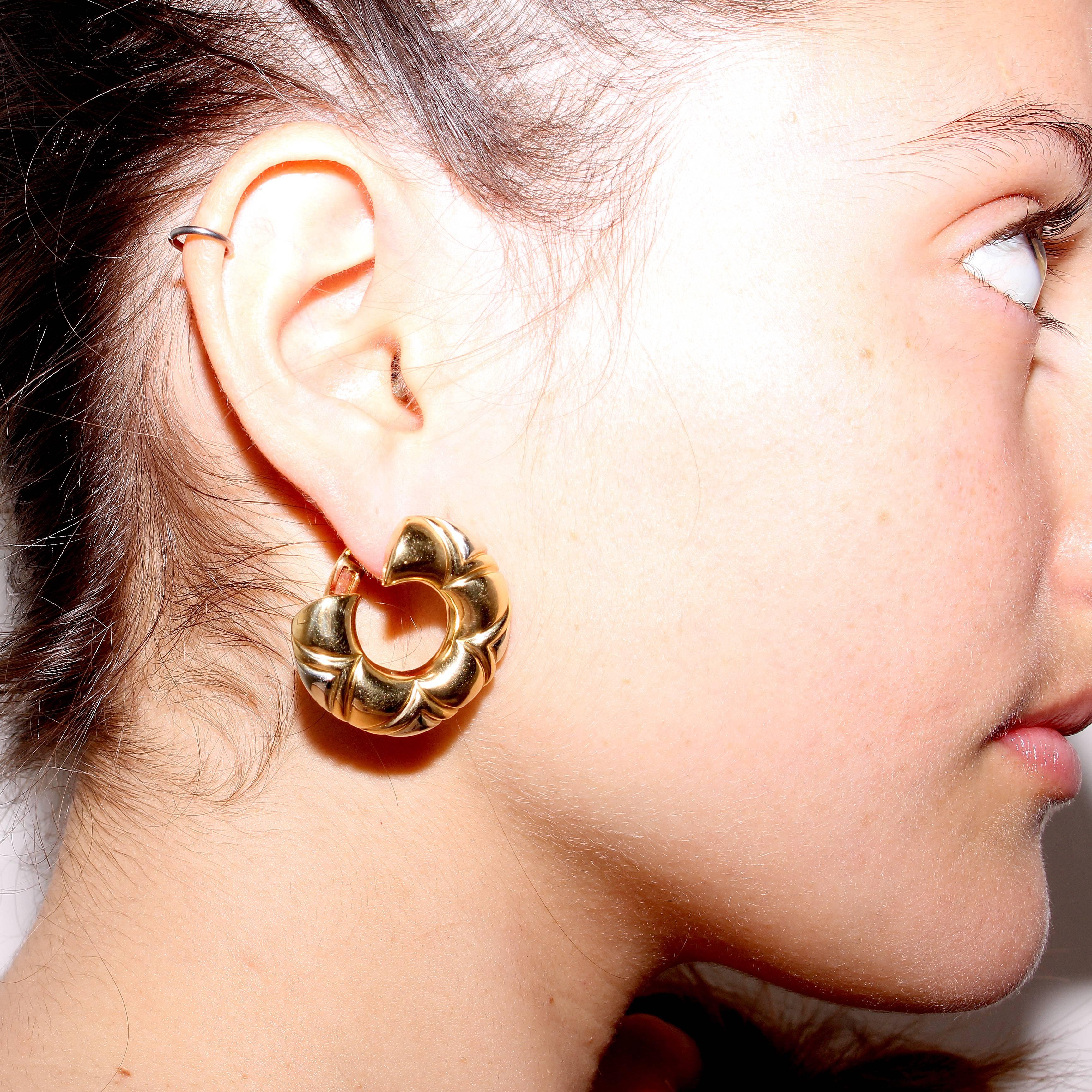 Stylish, golden earrings from Bulgari. Designed in 18k gold. Signed Bvlgari.
