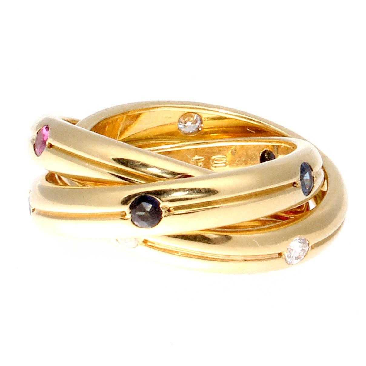 Cartier, elegant and timeless. Fashioned with lively rubies, sapphires and diamonds. Hand crafted in 18k yellow gold.

Ring size 6.
