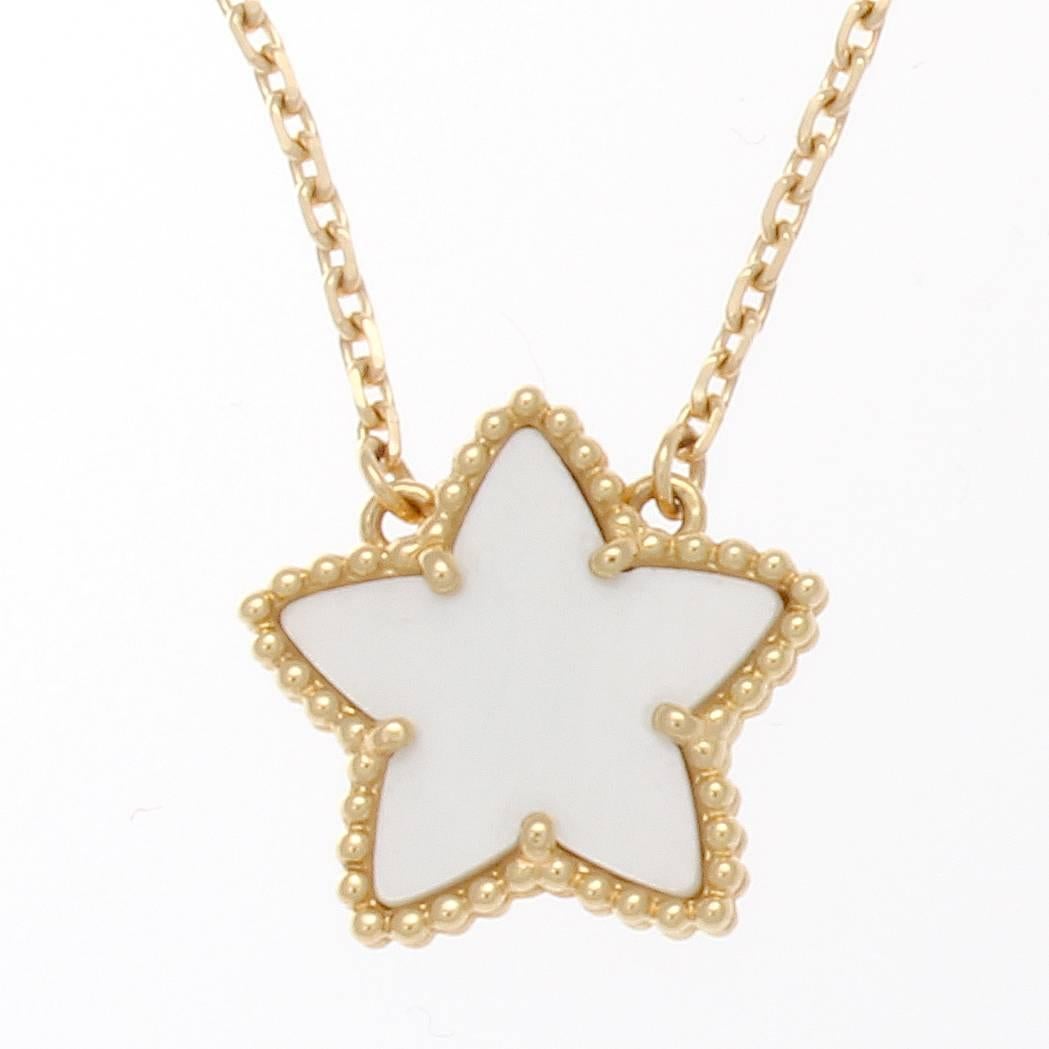Van Cleef & Arpels, a long rich history of trend setting fashion that is still relevant today. A rare two sided mother-of-pearl and 18k yellow gold star motif necklace from the lucky alhambra collection. Signed VCA and numbered.

Length is 17