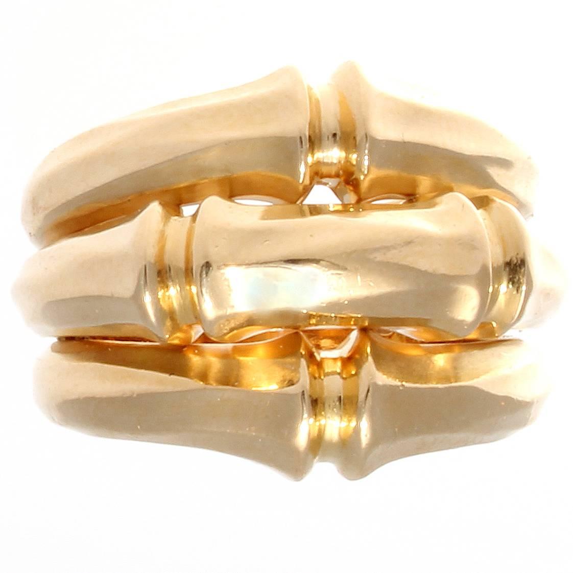 Cartier, elegant and timeless. Designed with 3 rows of sleek textured 18k yellow gold. Signed Cartier and numbered.

Ring size 7.
