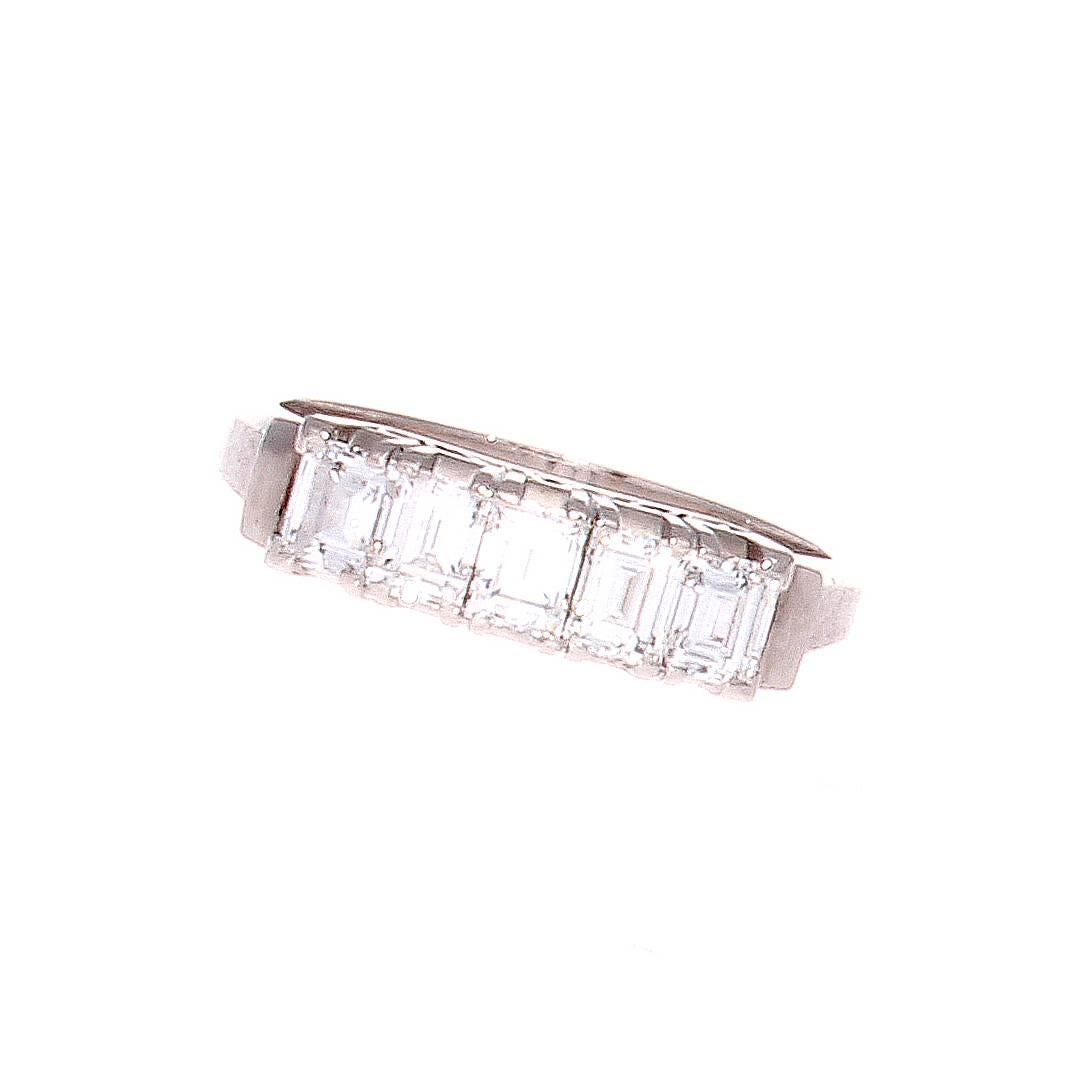 A lovely creation that proves simplicity is the true elegance. Created with 5 emerald cut diamonds that weigh 1.00 carats. H-I in color and VS+ in clarity. Crafted in 18k white gold.

