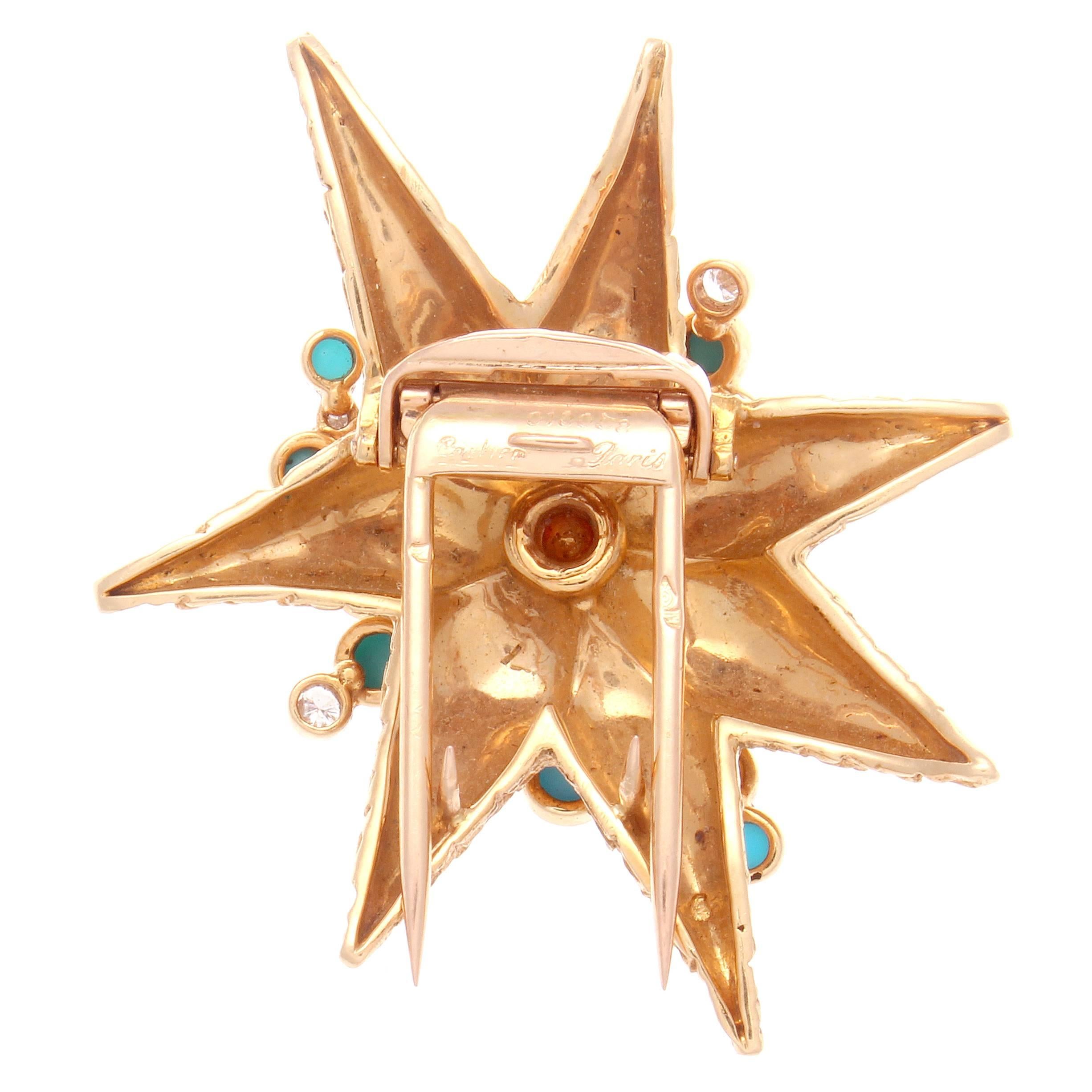 The asymmetrical starfish design features fine Persian turquoise cabochons and clean white round diamonds. The 18k gold is expertly textured to represent the starfish. Signed Cartier Paris and numbered.

1-3/4 inches x 1-1/2 inches