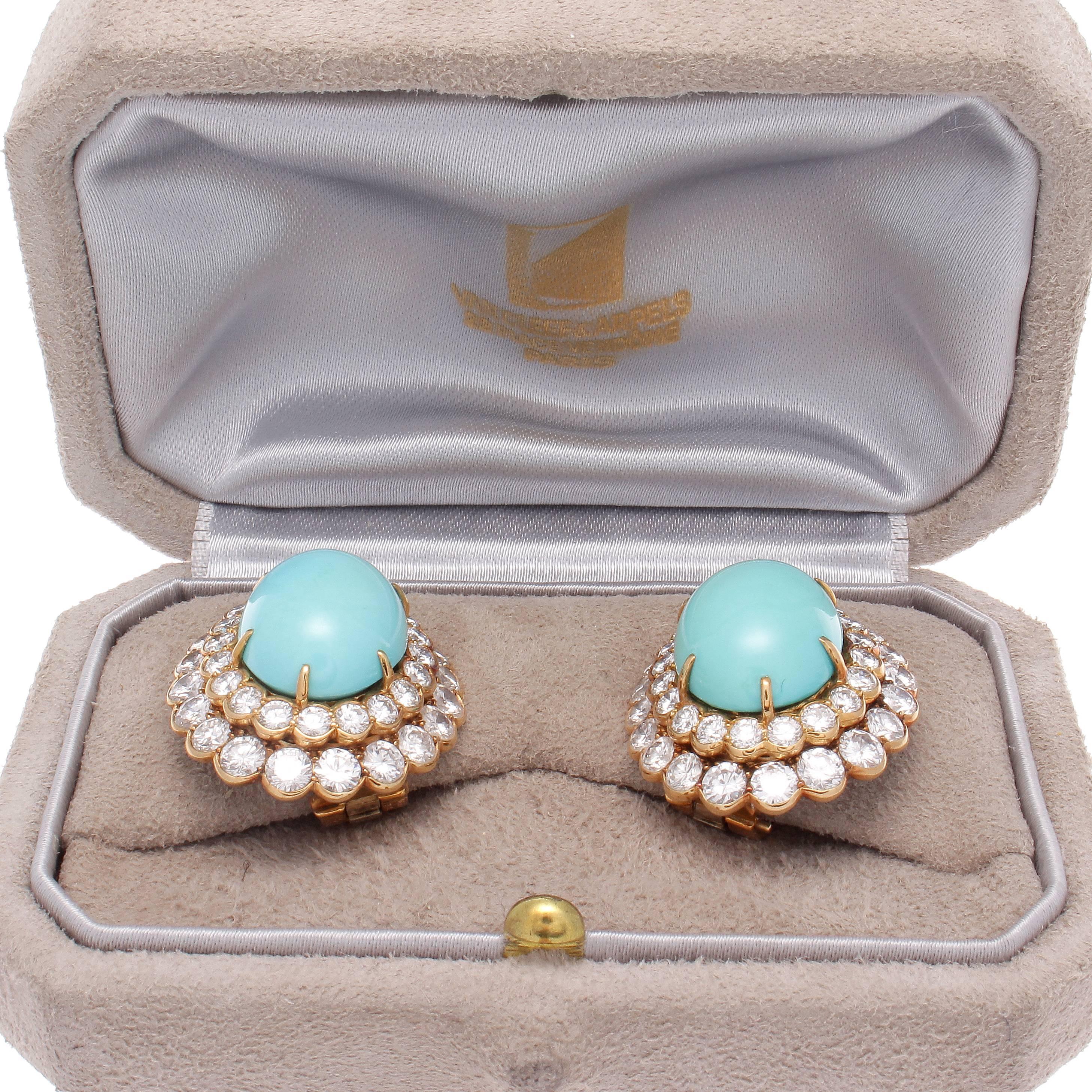 Superior craftsmanship from Van Cleef & Arpels. Created with two large vibrant cabochon turquoise that is surrounded by cascading halos of near colorless diamonds weighing approximately 8 carats total. Hand crafted in 18k yellow gold. Signed VCA,