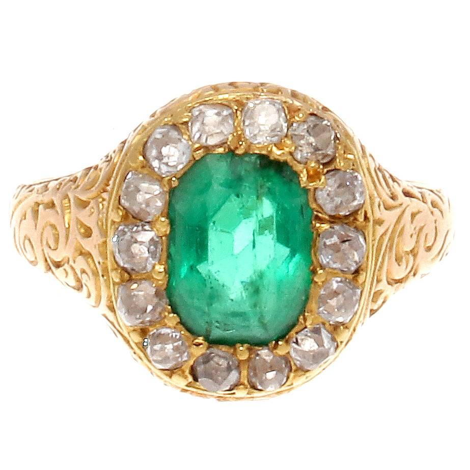 A sensational period piece that has all the characteristics true to the belle epoque era. Designed with a vivid gem quality forest green emerald that is outlined by a halo of old cut diamonds.Featuring an 18k yellow gold filigree ring.

Ring size