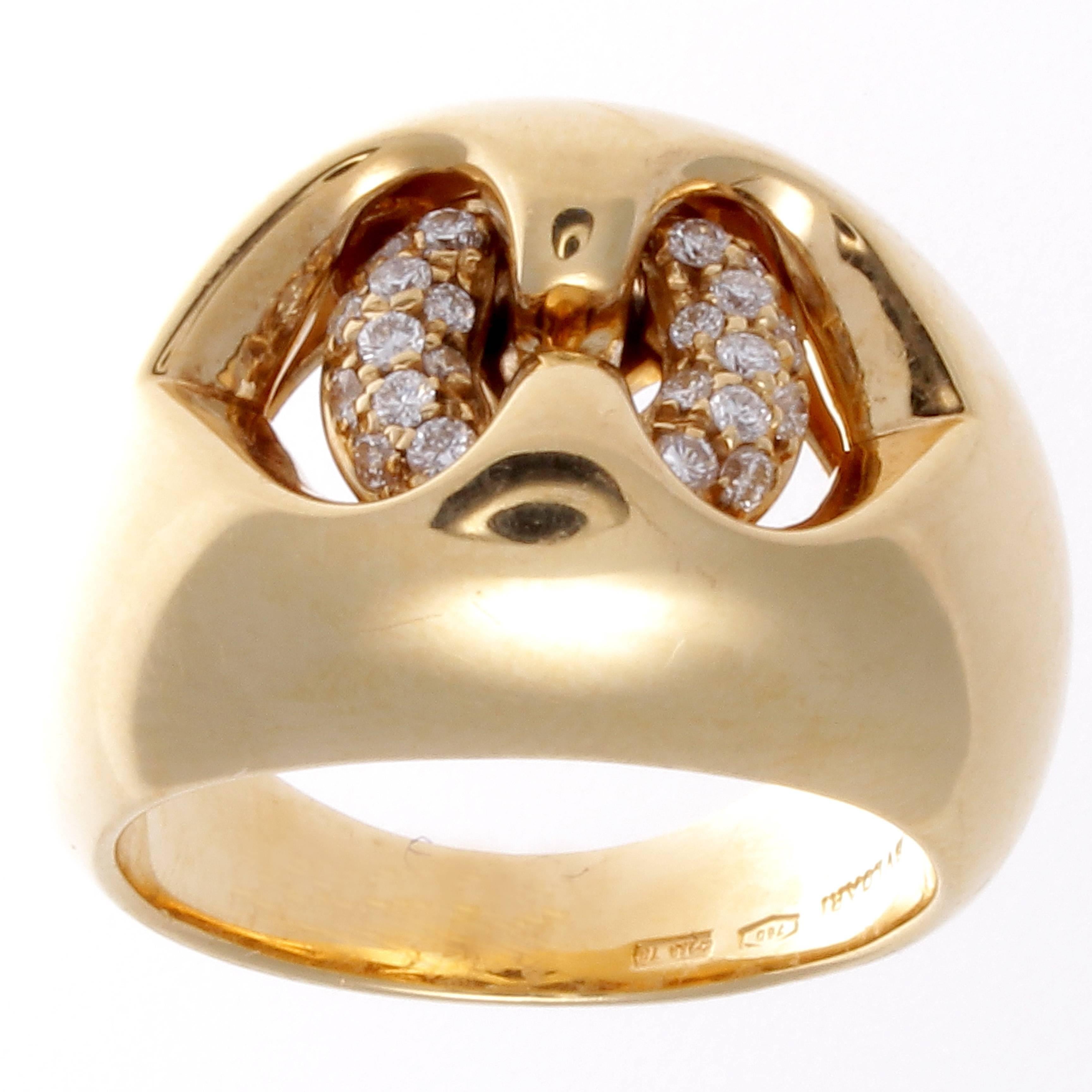 A unique design from Bulgari. Featuring open spaces filled with diamonds. Crafted in smooth curving lines of 18k glistening yellow gold. Signed Bulgari. 

Ring size 6 and may be resized.