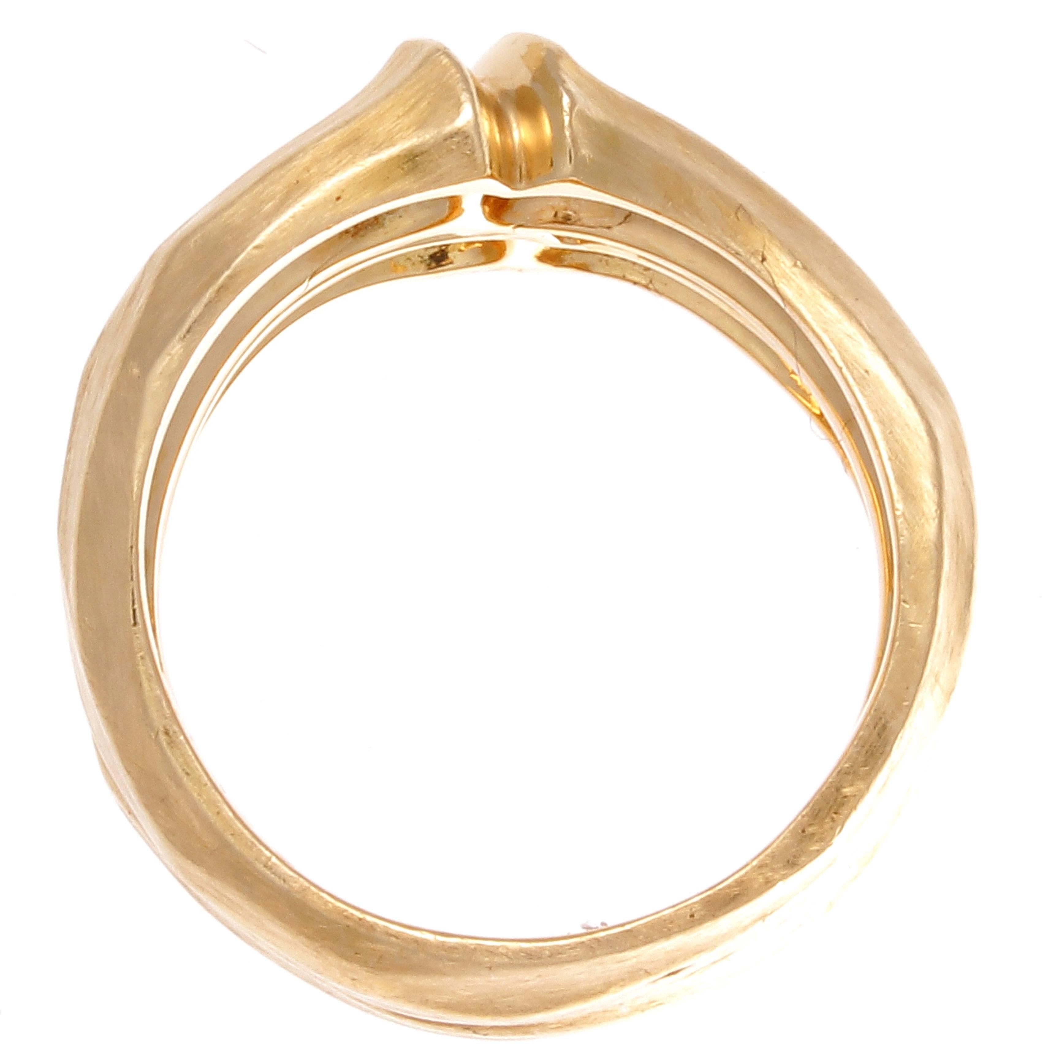 From the bamboo collection at Cartier.  Created in glistening 18k textured yellow gold. Signed Cartier, numbered and stamped with french hallmarks.

Ring size 5-1/4