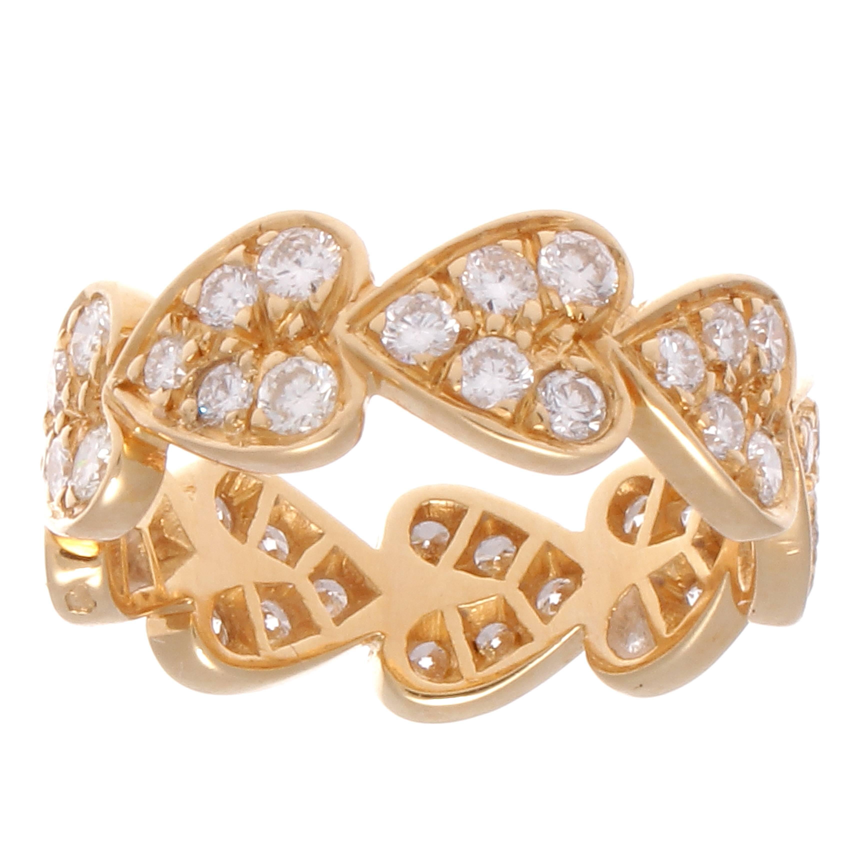 A creation of passion from Cartier. The circle of hearts and diamonds representing promises fulfilled. Crafted in 18k yellow gold. Signed Cartier, numbered and stamped with French hallmarks.

Ring size 6-1/4.
