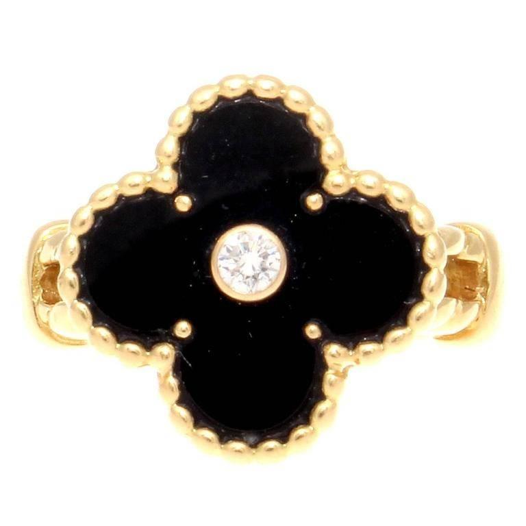 Staying true to the first Alhambra design which was created in 1968 to symbolize luck, health, fortune and love from Van Cleef & Arpels. Designed with jet black onyx that is decorated with a single round cut white diamond in the center weighing 0.06