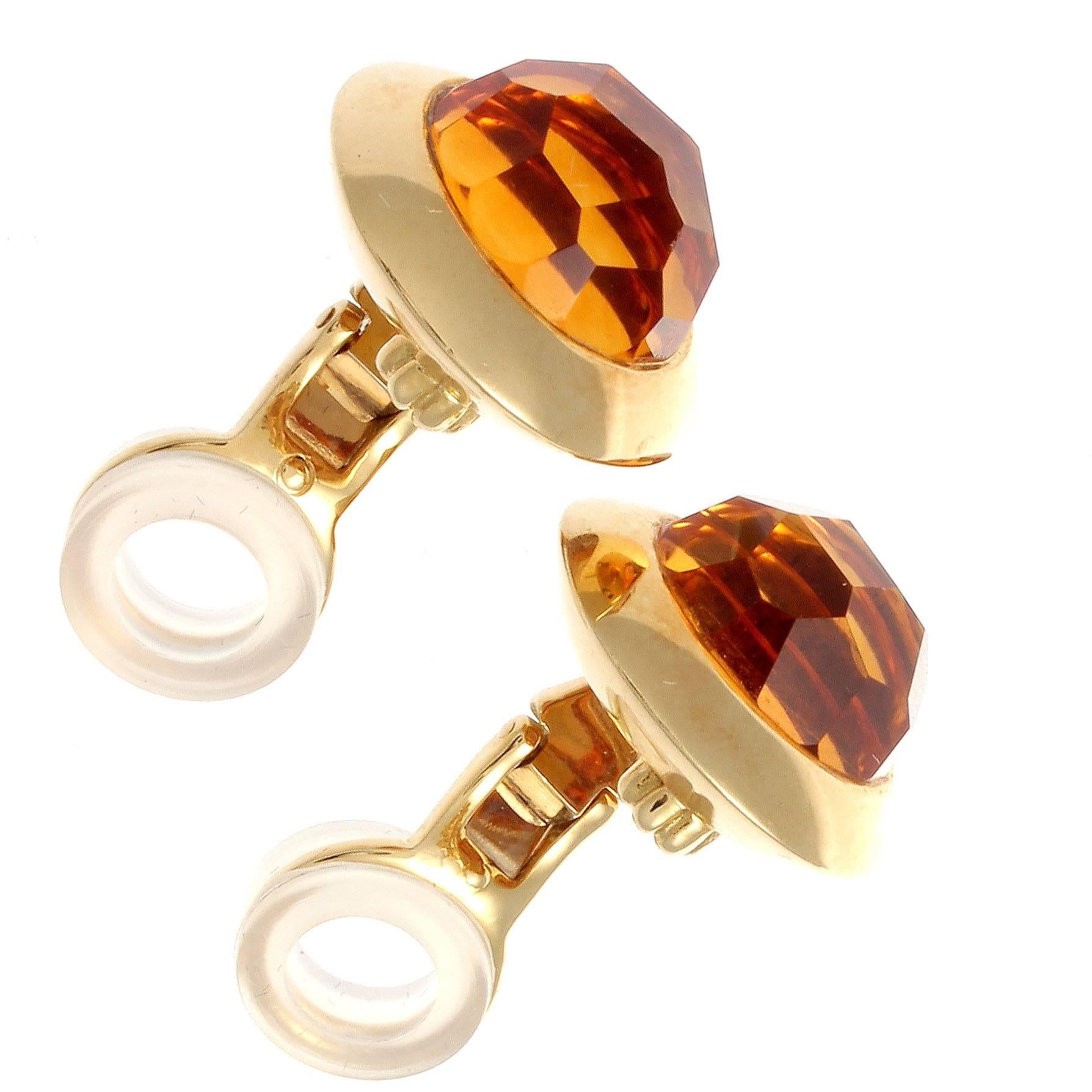 An innovative design from the Italian house of Pomellato. Featuring lively  faceted cabochon cut citrine's that are surrounded by the familiar Pomellato 18k yellow gold mixture. Signed Pomellato.