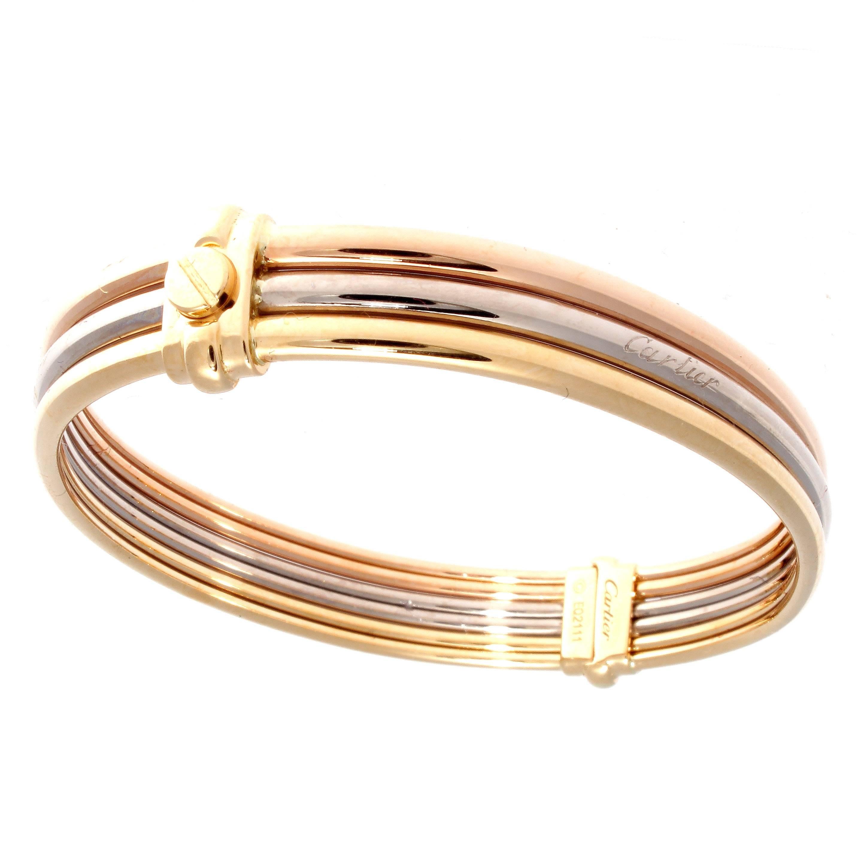 A unique integration of the two most famous designs from Cartier. Cleverly combining the love and trinity collection into one tricolor 18k gold bracelet. Specifically made for Cartier employees and is hardly made available to the public. Signed