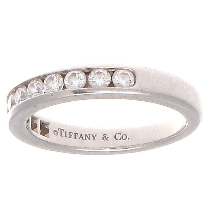 Timeless elegance from the masters of the wedding ring at Tiffany & Co. Designed with 11 diamonds weighing approximately 0.50 carats that flow freely across the band being effortlessly channel set in the platinum ring. Signed Tiffany & Co.

Ring