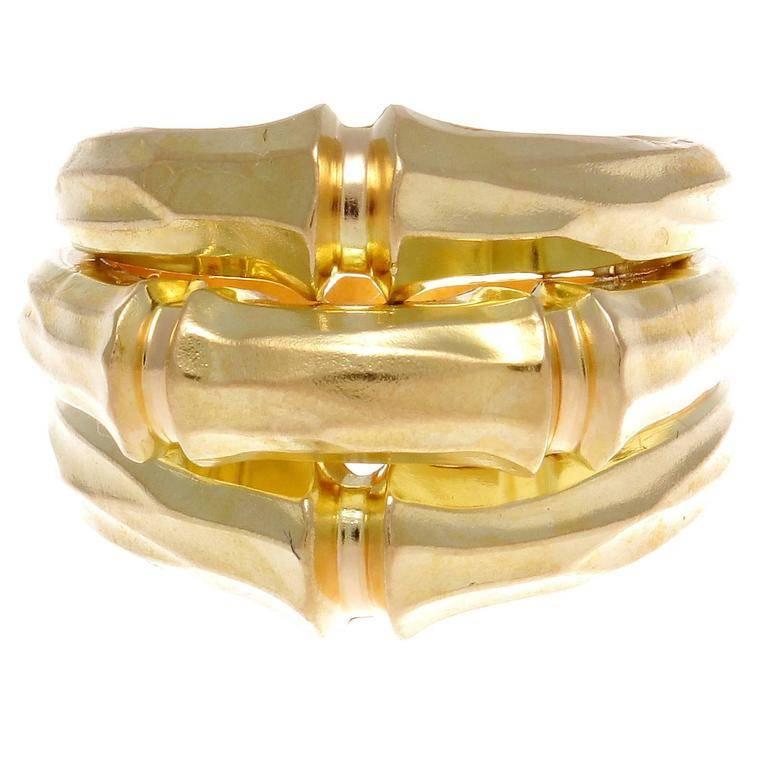 Cartier, one of the top two jewelry brands. This is the famous large 18k gold bamboo ring from the 1990's. The finely shaped gold is in the tradition of the great French sculptors.   

Ring size 8 1/2 and may be resized to fit.