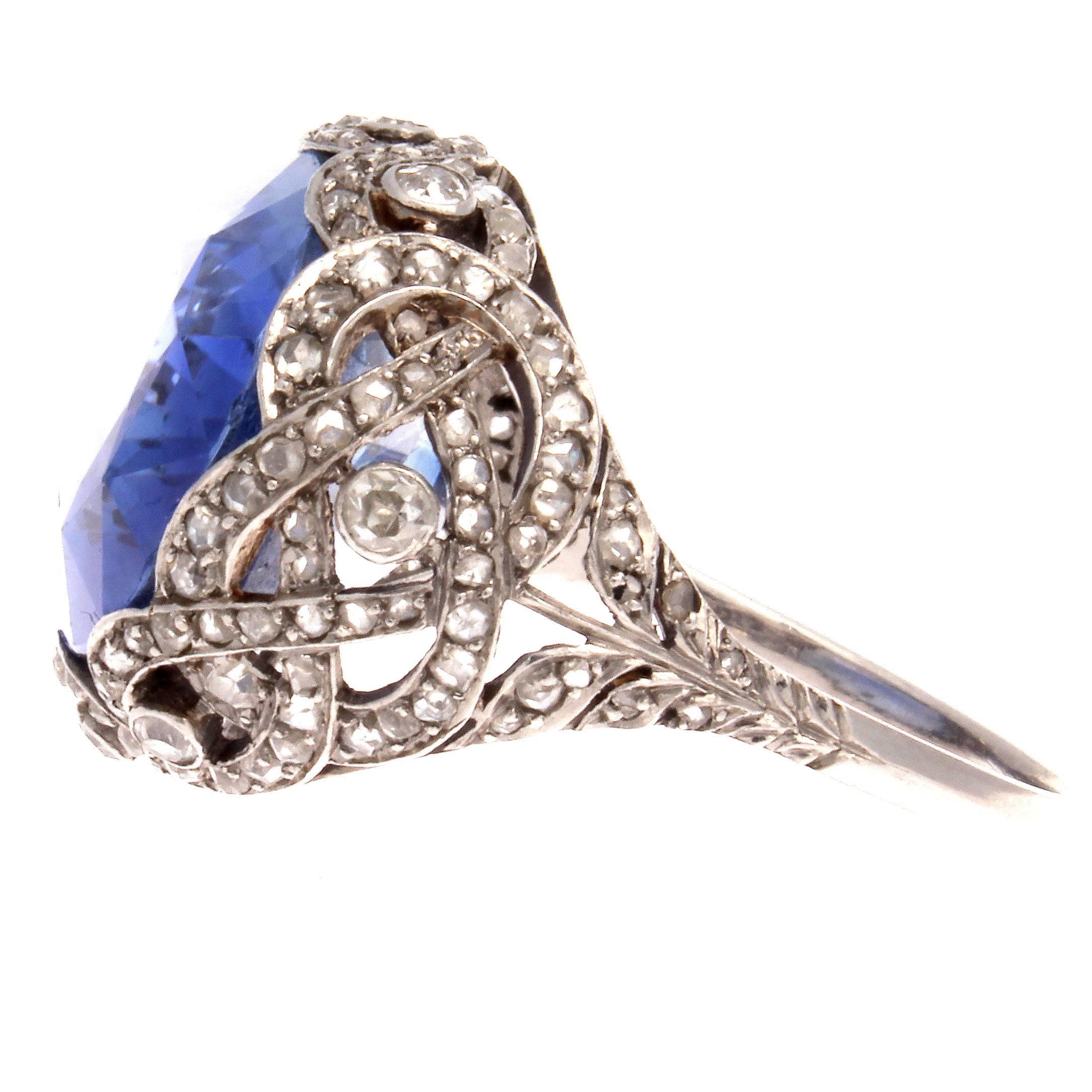 An intricately beautiful Art Deco ring featuring a desirable sky blue sapphire that weighs 16.40 carats. GIA certified as ceylon origin with no indications of heat treatment. Hand crafted with free flowing intertwining rows of platinum that are