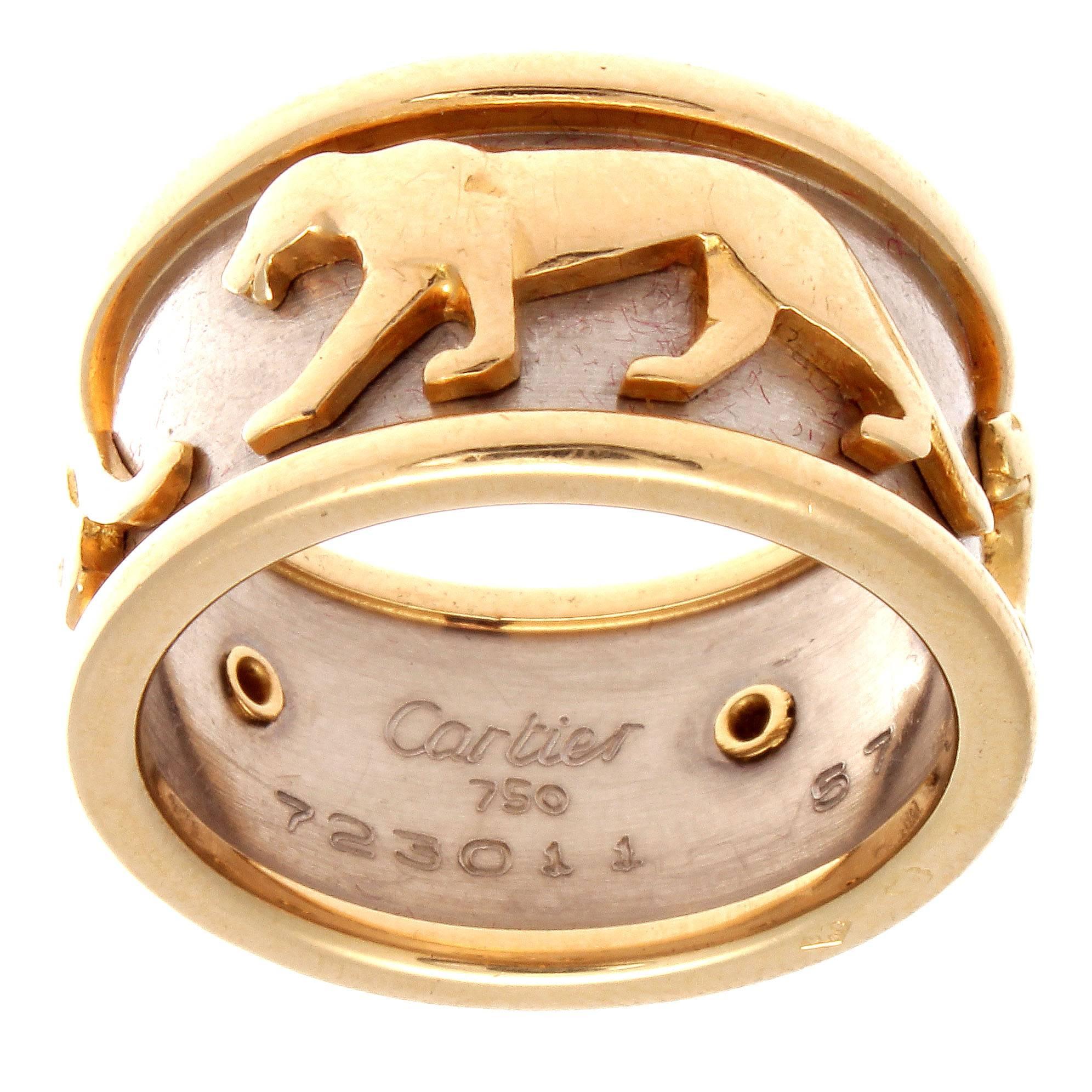 The classic Panthere collection from the stylish designers at Cartier. Crafted in 18k yellow and white gold. Signed Cartier and numbered.

Ring size 8-1/4.