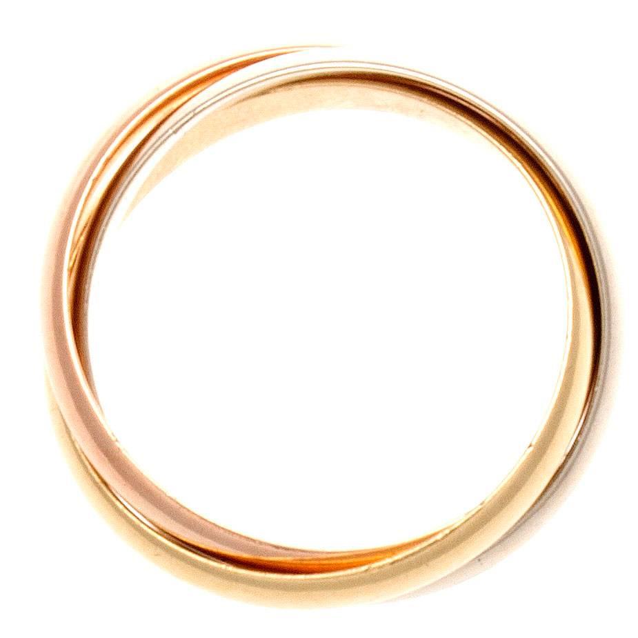 A timeless celestial design from Cartier. Created in the famous tricolor gold: pink gold for love, yellow gold for fidelity and white gold for friendship, intertwined in a display of unity and harmony. Signed Cartier and numbered.

Ring size 50 or