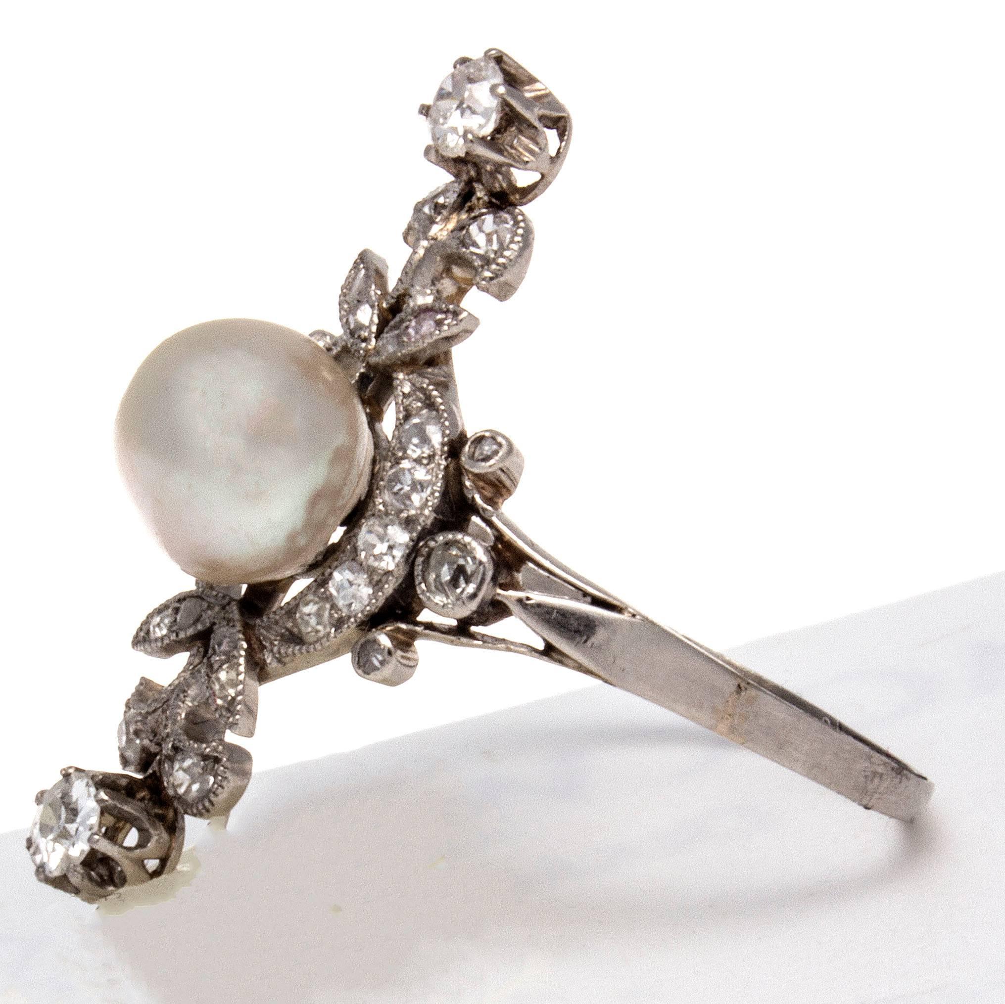 The ring is intricately crafted in platinum featuring a pearl that is GIA certified as a natural salt water. With numerous clean white diamonds adorning the ring.

Ring size 8 and may be resized to fit.