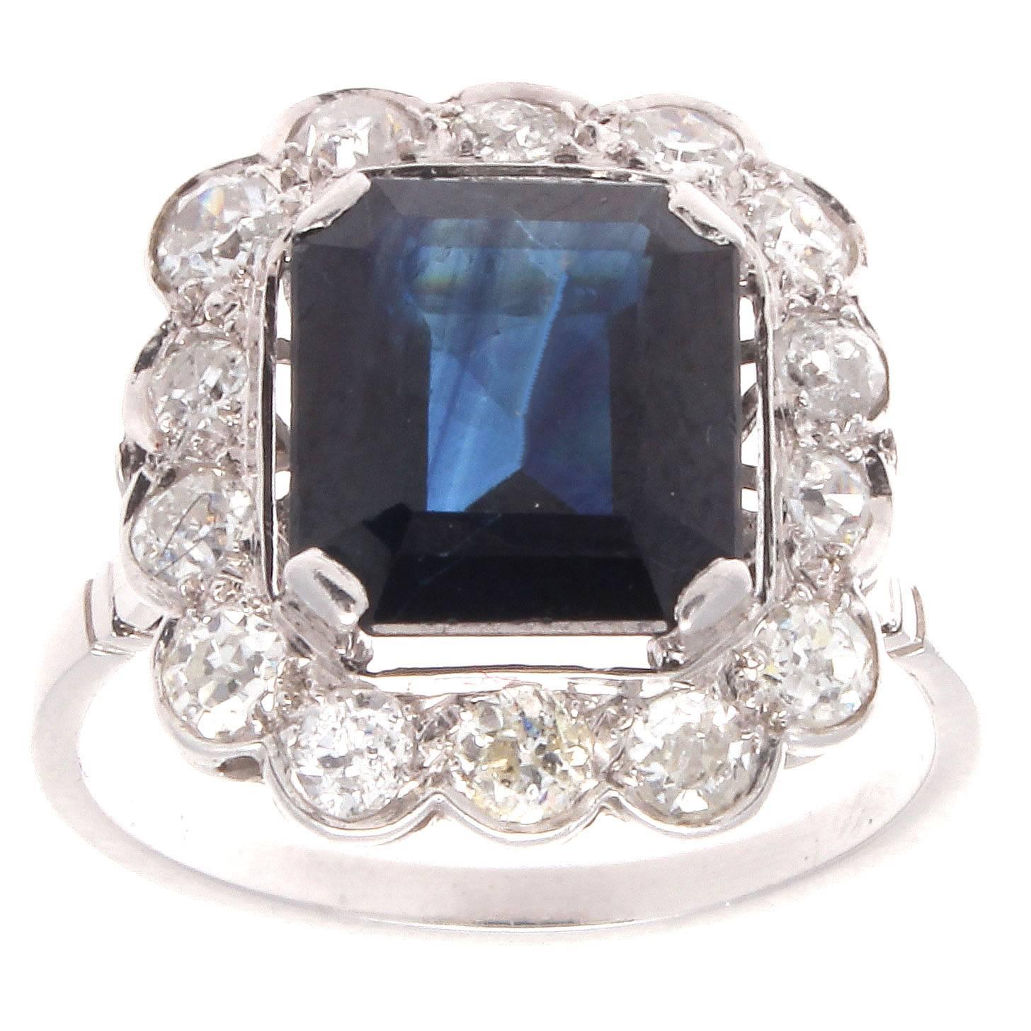 A stylish creation of pure artistry from Paris. Featuring a deep blue emerald cut sapphire that has been elegantly surrounded by a halo of near colorless diamonds. Hand crafted in platinum.

Ring size 6-3/4 and may be resized to fit.

 
