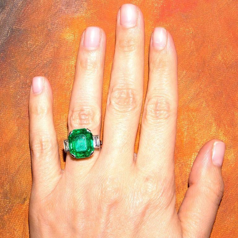 A Colombian emerald of exceptional color and brilliance. 
The emerald is set in a diamond platinum ring which perfectly displays its beauty. The emerald weighs 10.03 carats and is certified by AGL as natural Colombian.

For thousands of years,