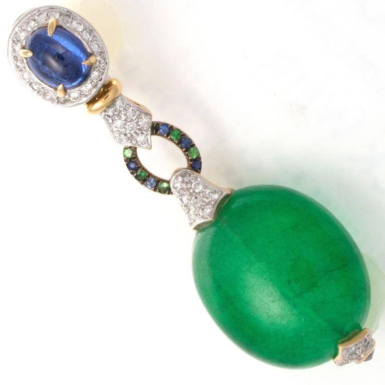 Bold stylish design, featuring translucent and vibrant green quartz that is perfectly complemented by glowing blue sapphires and clean, white diamonds. Hand crafted in platinum and 18k yellow gold.