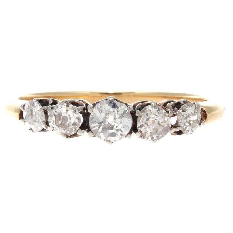 From the Victorian era, the classic 5 stone ring. Designed with 5 old European cut diamonds weighing approximately 1.10 carats elegantly set in a hand crafted 18k gold ring.  

Ring size 7-3/4 and may be resized.