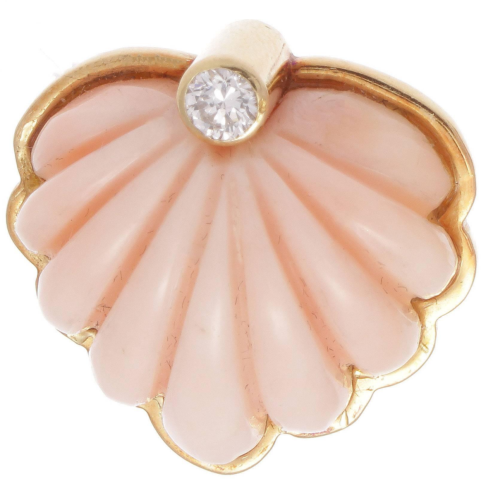 Finely constructed  design combined with eye pleasing color combinations defines post retro jewelry. The carved warm pink angel skin coral is perfectly finished with a single white, clean diamond on each earring. Hand crafted in 18k gold.
