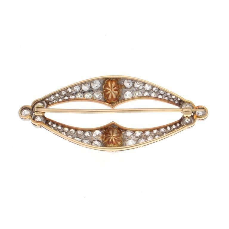 A beautifully created Art Deco brooch that has elegance in simplicity. Designed with 70 clean, white diamonds weighing approximately 3 carats that perfectly compliment the pearls. 