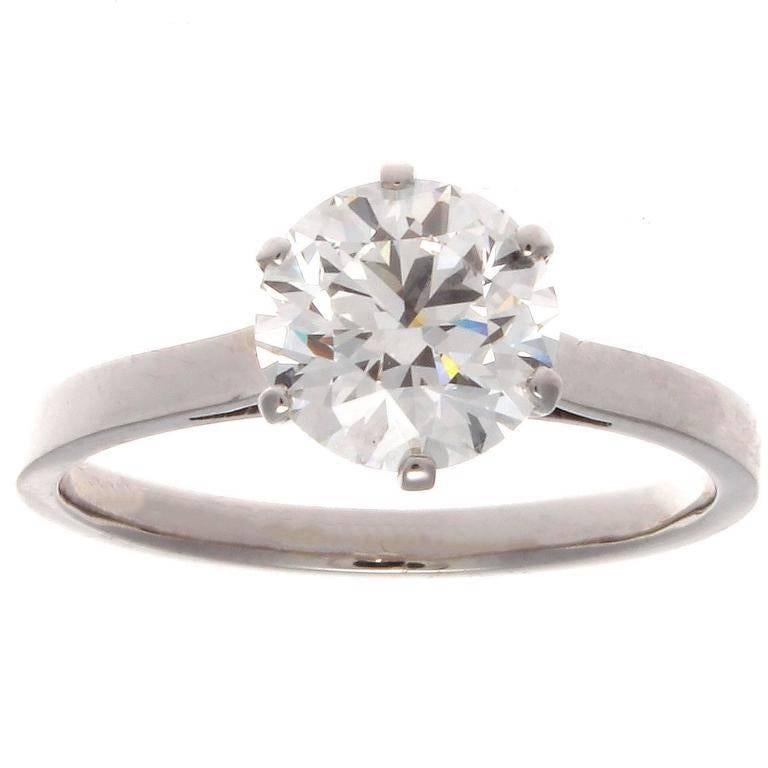 The classic Tiffany style engagement ring designed with 6 prongs and smooth understated contours of platinum to emphasize the natural beauty of the diamond. Featuring a GIA certified 2.01 carat round brilliant cut diamond that is J color, VS1