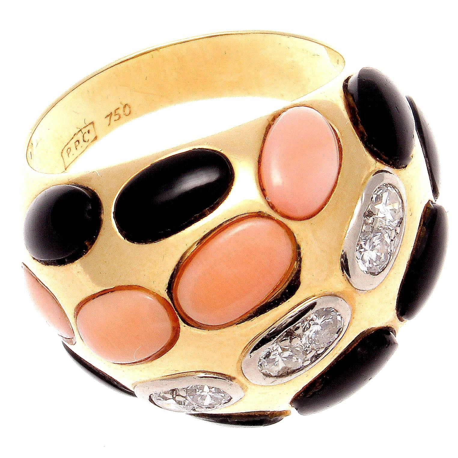 A colorful creation of abstract design. Featuring cabochon cut angel skin coral mixed with cabochon cut jet black onyx and near colorless diamonds. Crafted in 18k yellow gold. Please contact us if you would like to buy the matching earrings.

Ring