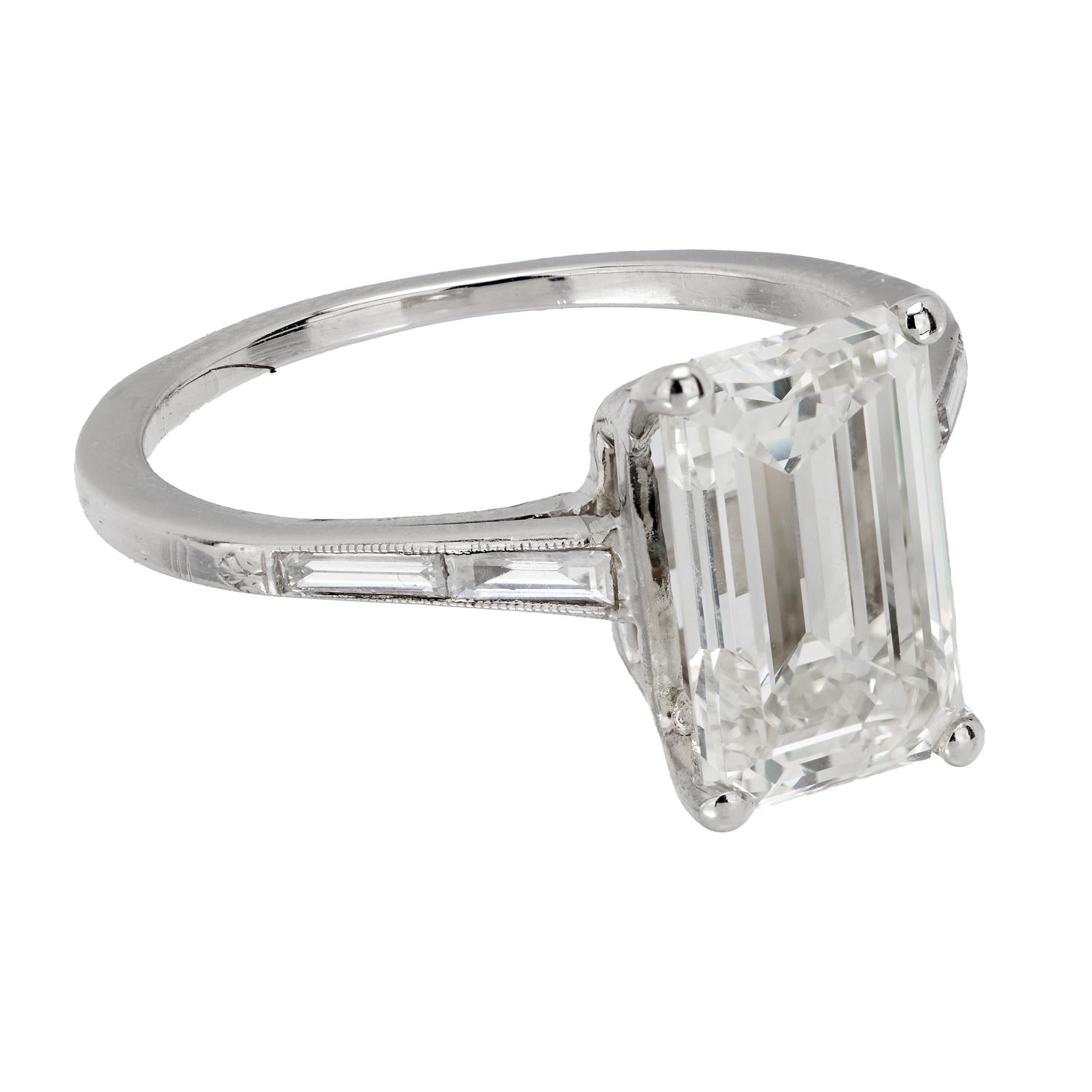 Modern GIA 3.21 carat emerald cut diamond platinum engagement ring For Sale