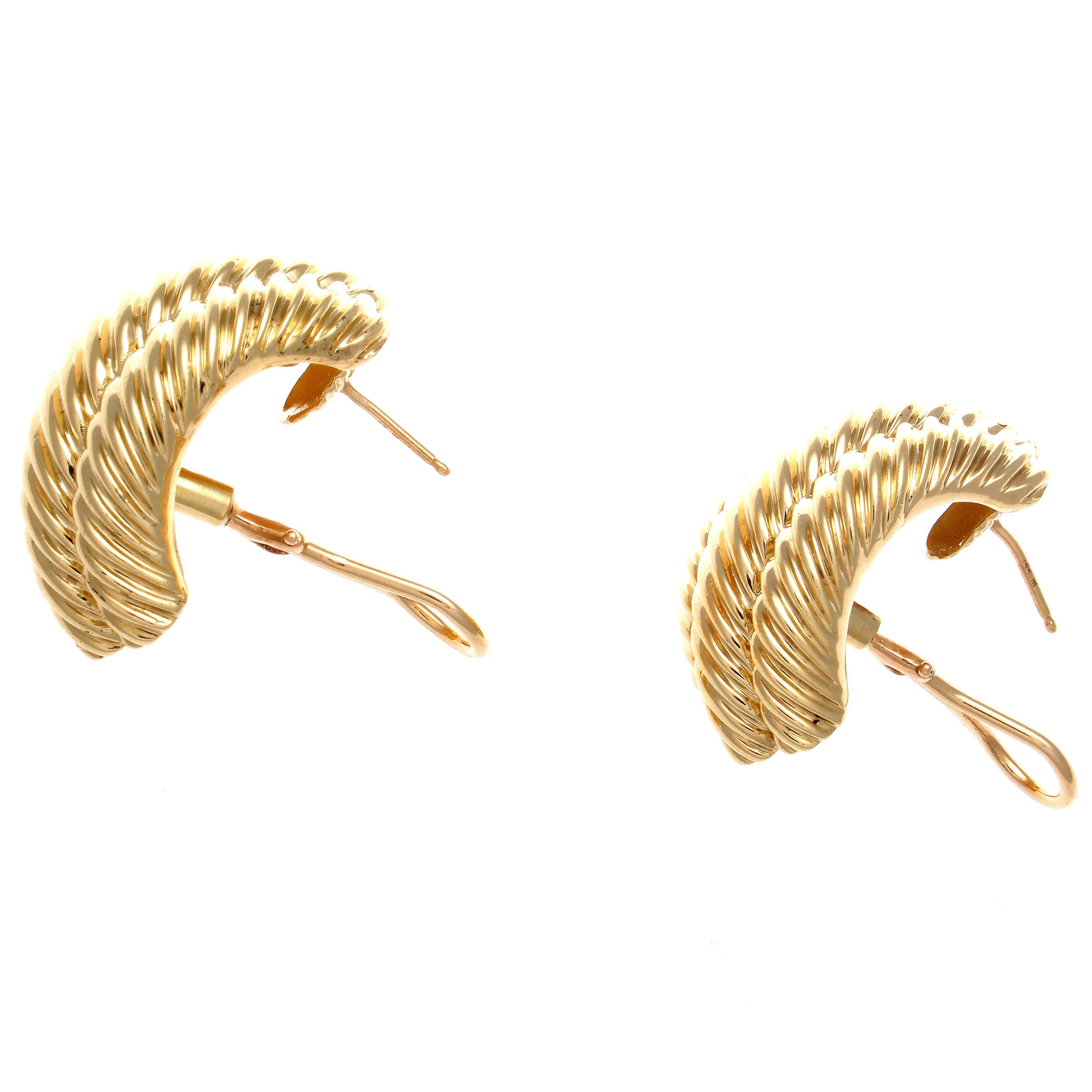 The twisted helix known as the cable design was first introduced in 1983 and is still David Yurman's most sought after creations. Designed in rolling contours of glistening 14k yellow gold that cascade down the ear. Signed David Yurman.

1-1/8