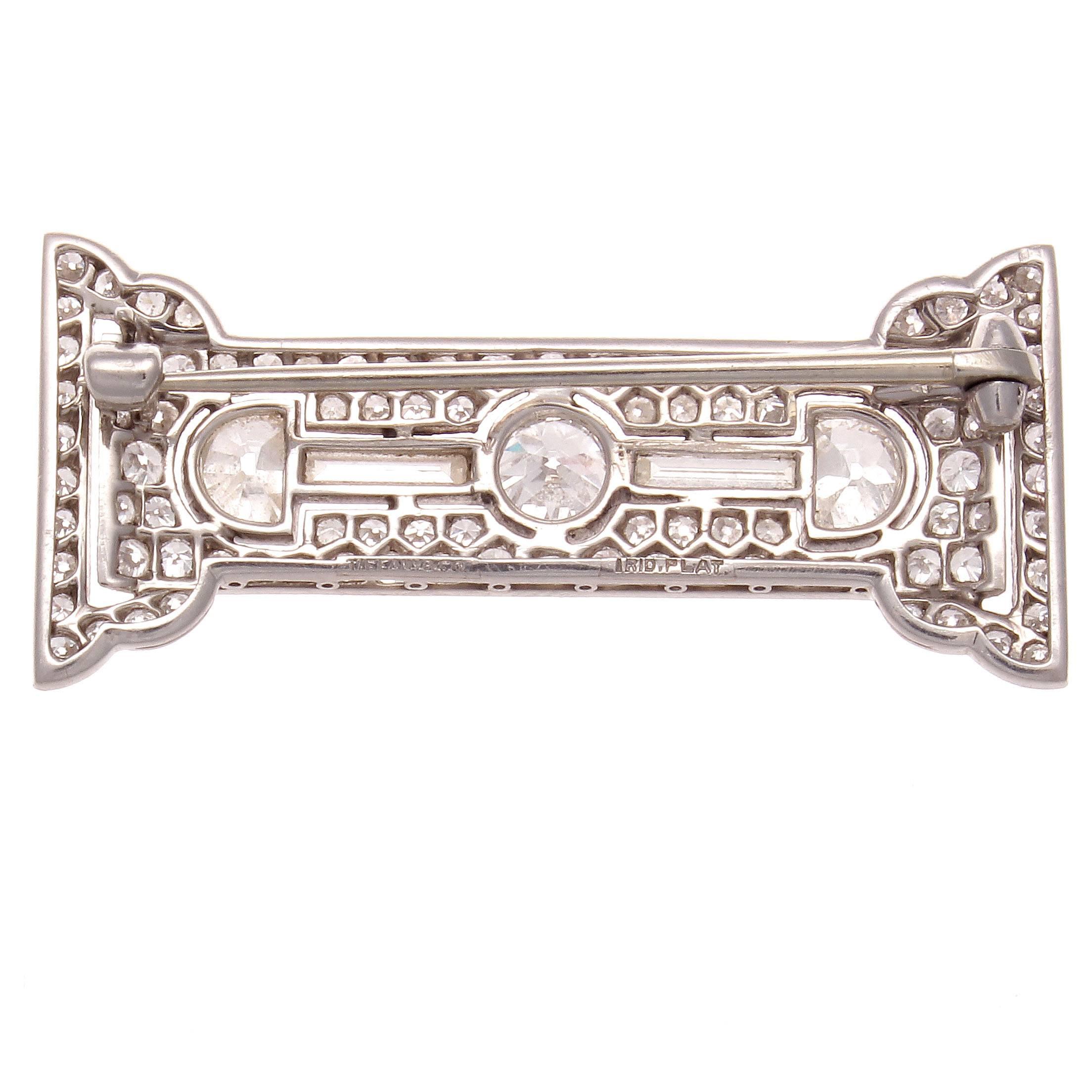 Always expressing the spirit of the times through superior design, Tiffany has captured the extravagance of the 1920's in this brooch. 

Featuring a mix of geometric shapes from round old European, baguette and half moon cut diamonds to create this