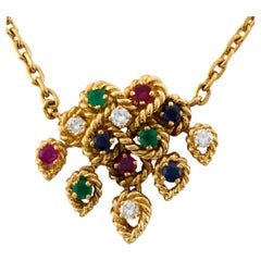 Collier Boucheron en or jaune 18k rubis émeraude saphir diamant