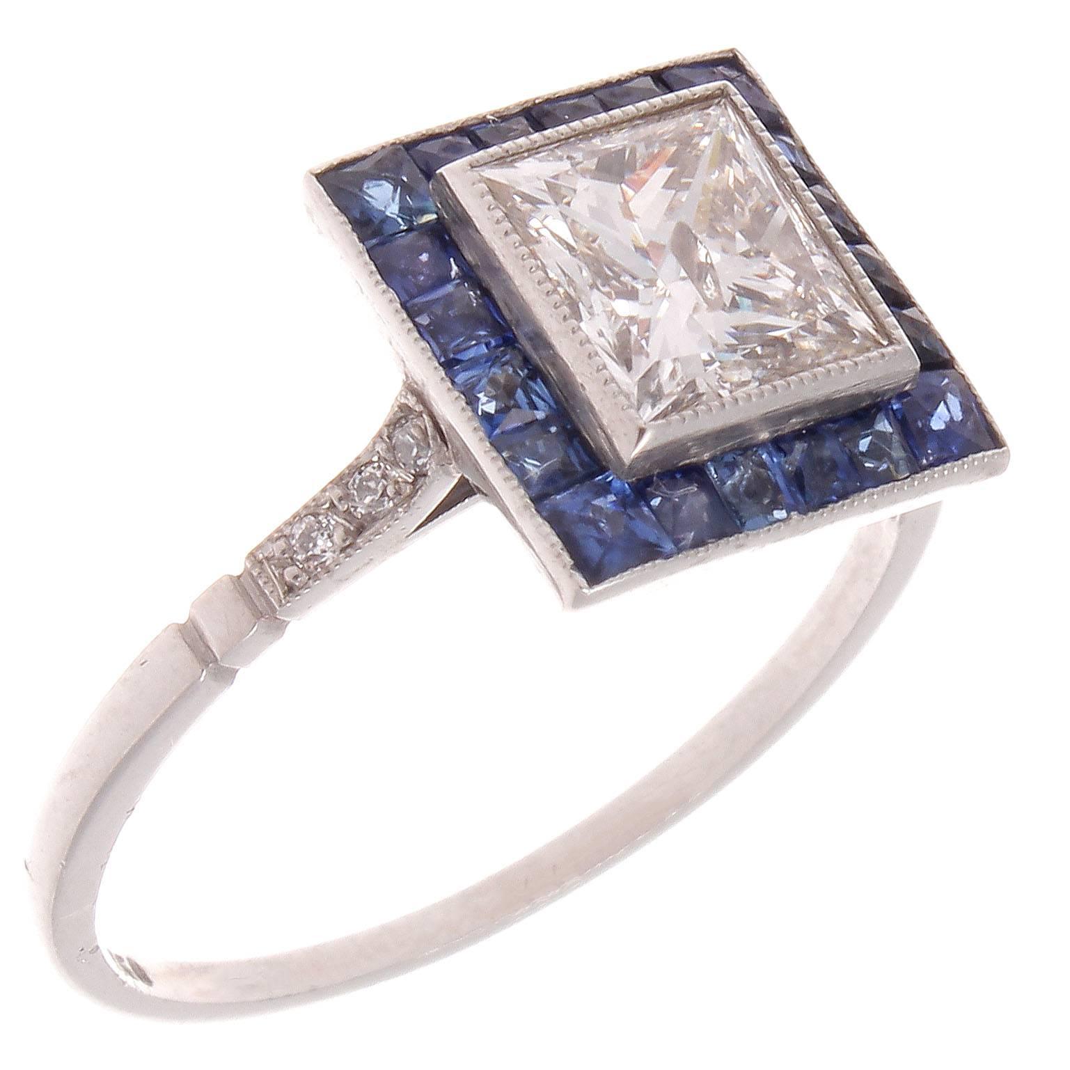 A modern rendition of the classic halo ring. Featuring a 1.13 carat princess cut diamonds that is F color, SI2 clarity surrounded by a halo of royal blue french cut sapphires. Crafted in plaitnum.

Ring size 7 1/2 and may easily be resized. 

