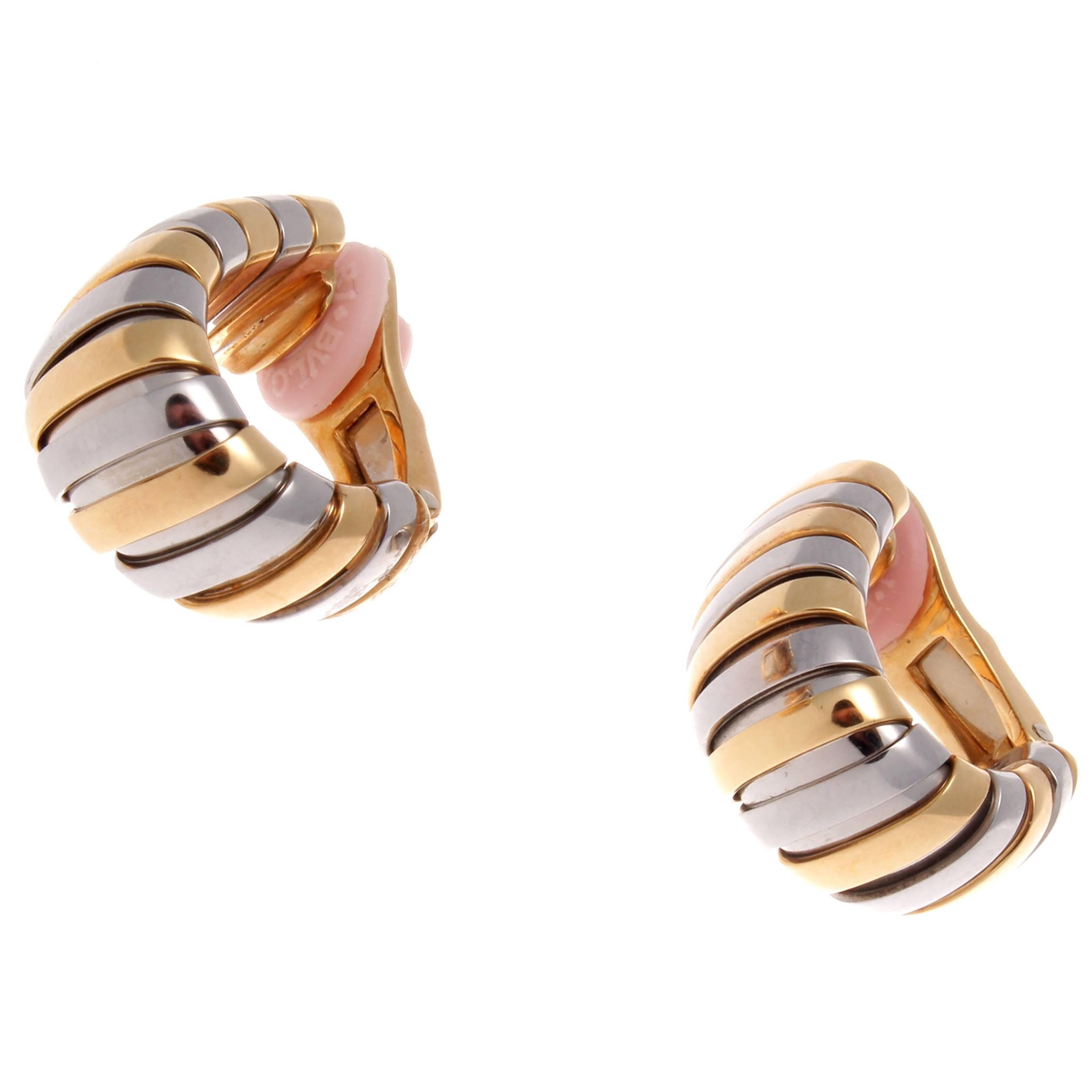 Bulgari's fascination with color and design has been transparent through all their creations. Designed with rolling contours of alternating stainless steel and glistening 18k yellow gold. Signed Bulgari.
