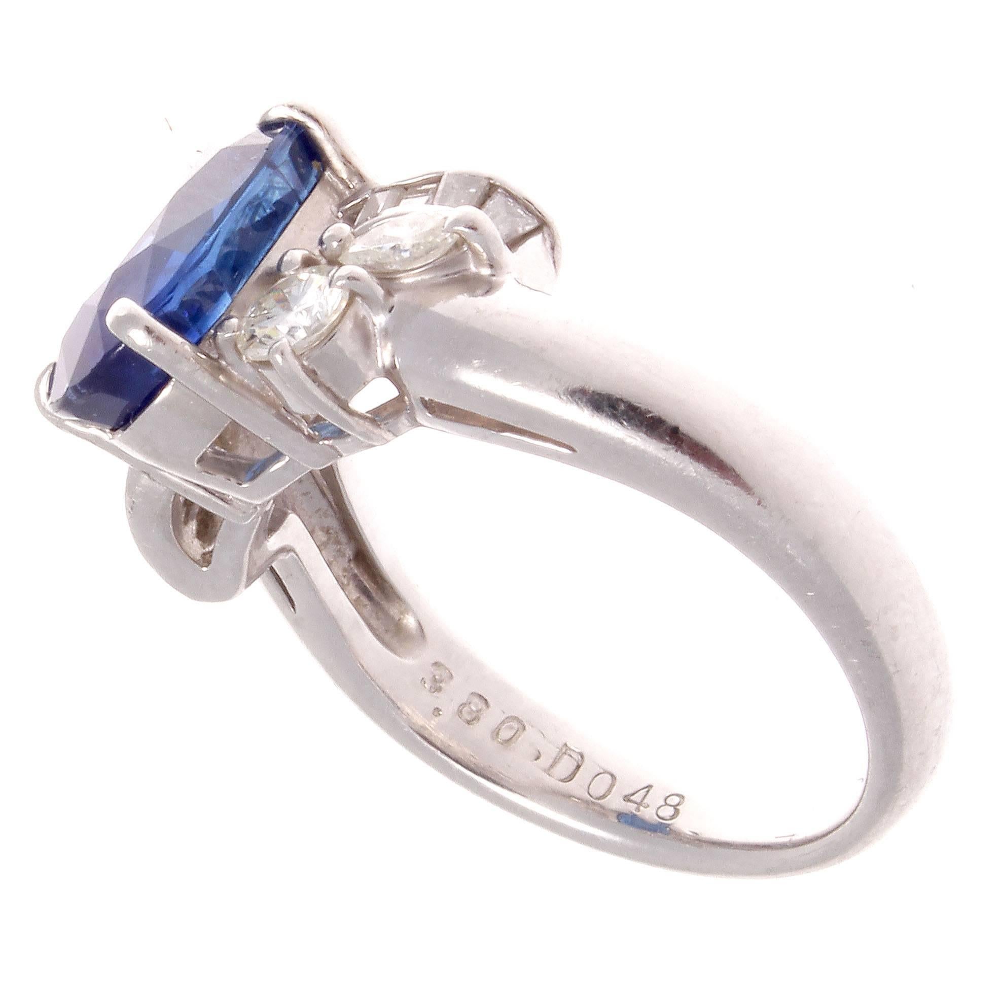 Serenity through color and design. Featuring a 3.80 carat royal blue sapphire that is accented by flowing lines of white clean diamonds on either side weighing 0.48 carats. Crafted in platinum.

Ring size 6 and may be resized