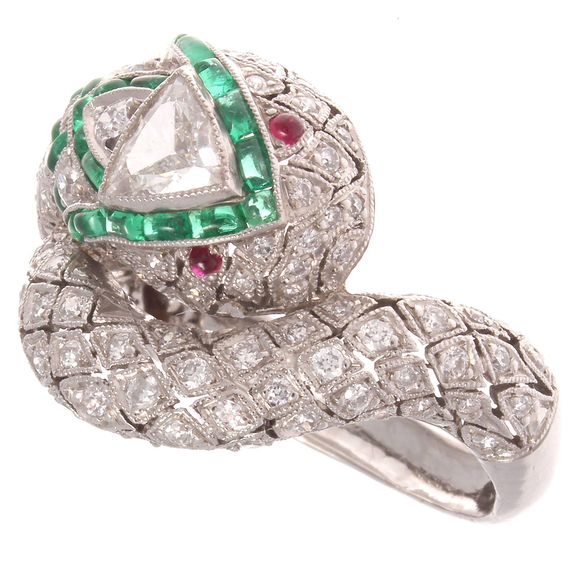 Snakes are great on the finger, not so much when you're hiking in the woods. Well designed with a triangle diamond head, ruby eyes and emerald accents on the head and body.

Ring size 7 1/4 and may be re-sized to fit.
