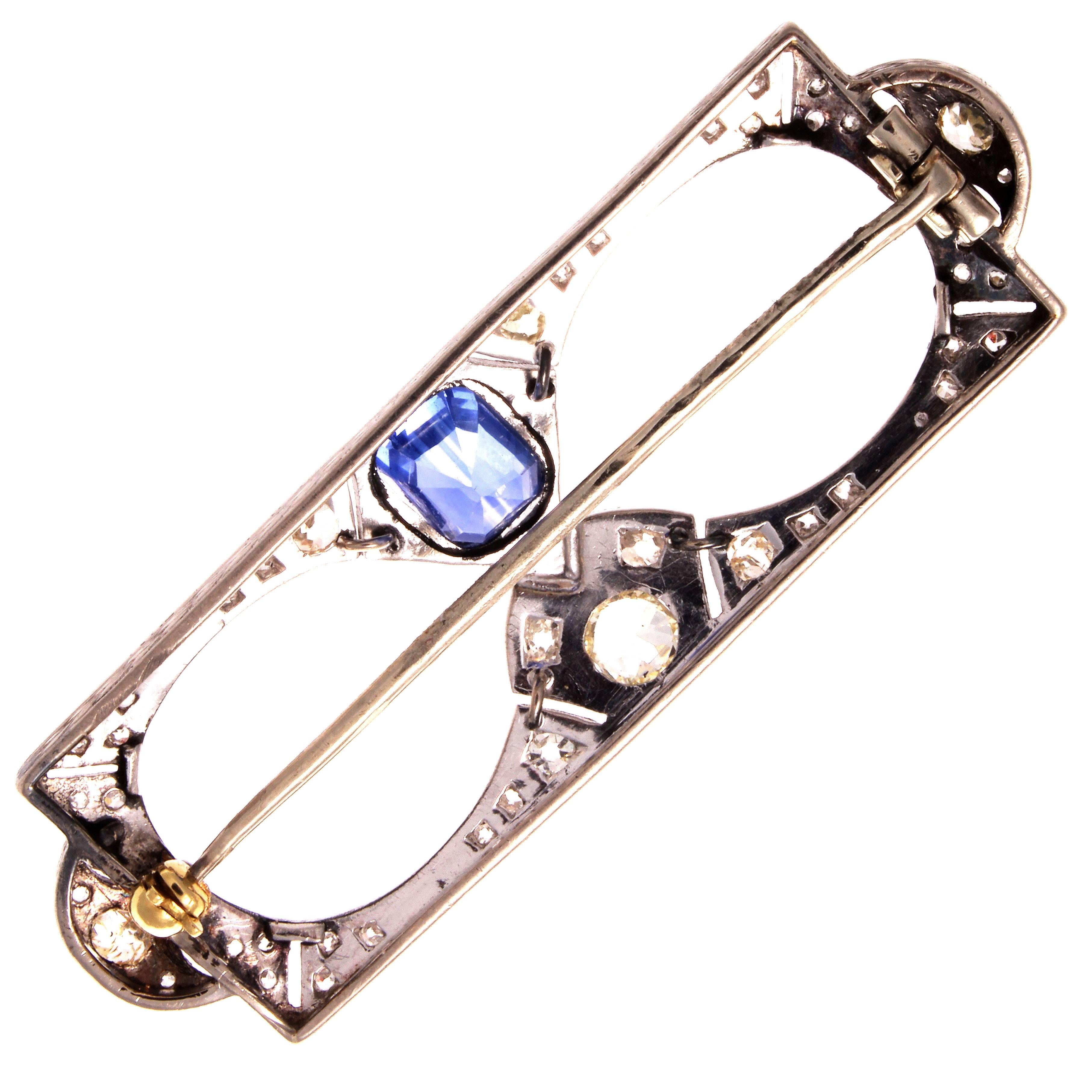 From the romantic and artistic Belle Époque era. An original brooch featuring a lovely blue sapphire of about 3+ carats. Hand made in platinum and gold with accenting diamonds.