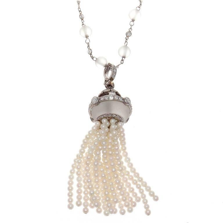 A creation of true excellence inspired by the historic Art Deco period. Gracefully created with diamonds perfectly separated by spheres of translucent rock crystal floating down to the superbly crafted rock crystal, diamond and free moving pearl