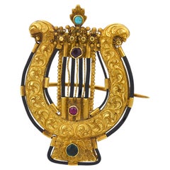 Victorian colored stone onyx 18k yellow gold lyre brooch