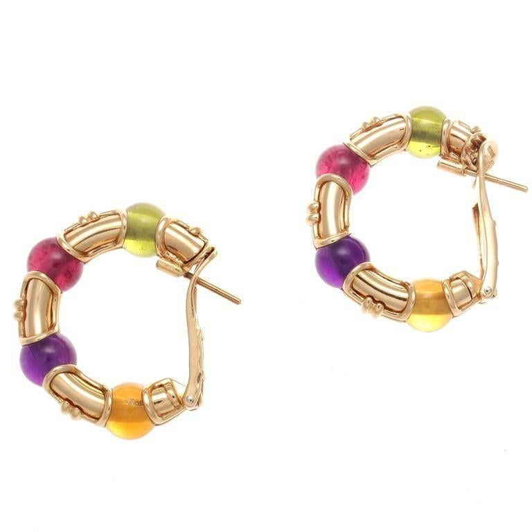 Andy Warhol in an interview said Bulgari jewelry is the 1980's. This is when their distinctive bold colorful designs became their iconic look. 

Featuring cabochon cut lively purple amethyst, golden citrine, reddish-pink tourmaline and green