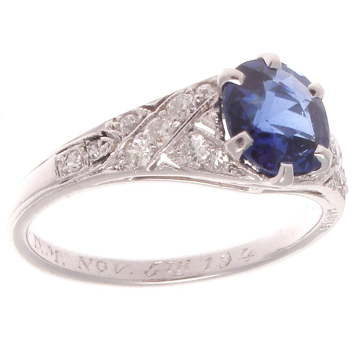Cartier demands the best colored stones for their jewelry regardless of size. This rich blue sapphire is set in an intricately hand engraved diamond platinum ring. Well made, eye catching and a pleasure to wear. 

Ring size 5 and may be re-sized to