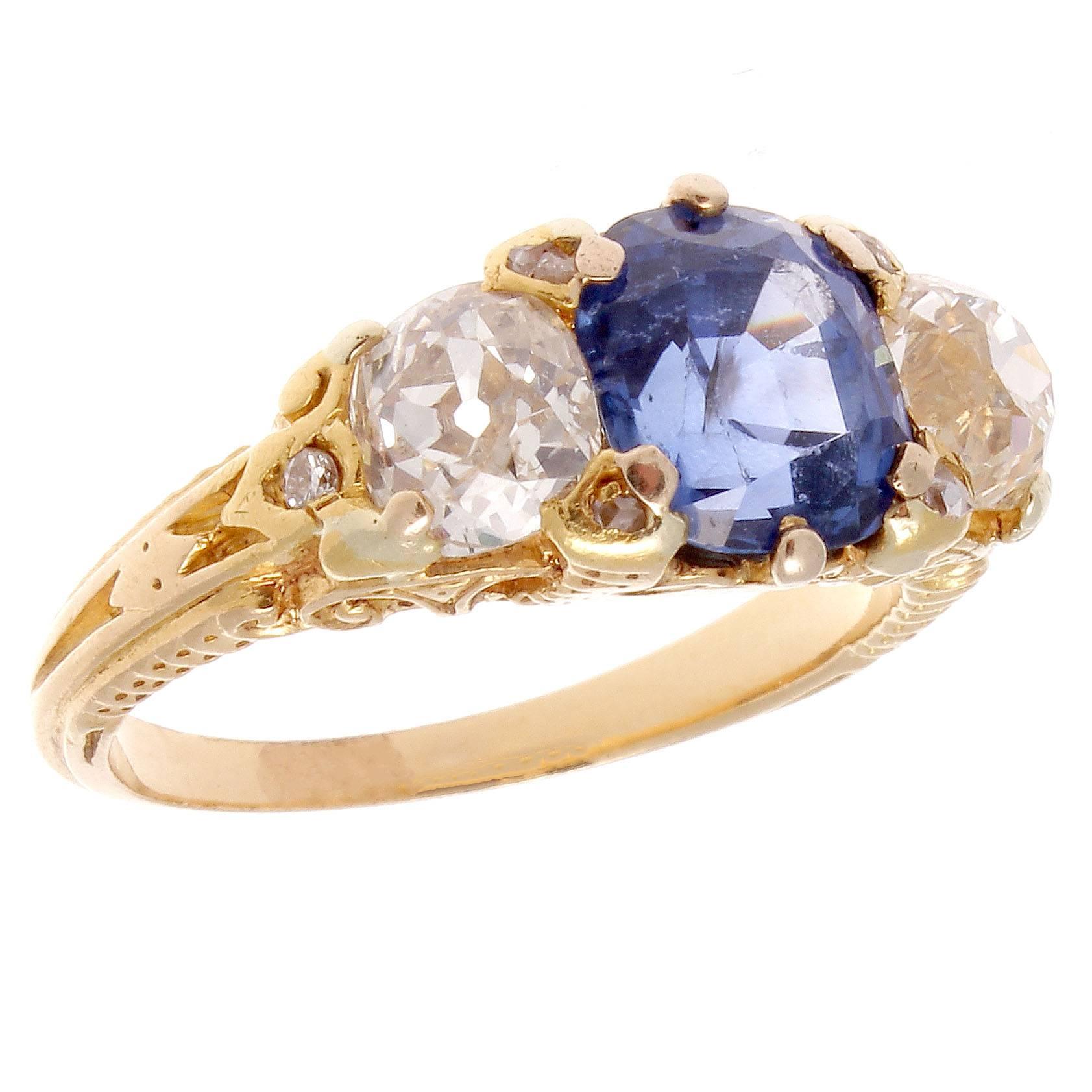From the attention to detail and hand engravings this type of craftsmanship from the Victorian into the art deco time periods is still yet to be matched. This classic three stone ring highlights the center cornflower blue Ceylon no heat sapphire