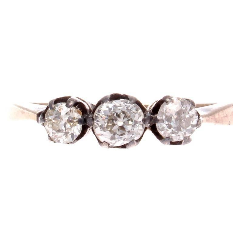 An elegant creation through simplicity in design. Featuring three white old cut diamonds elevated from the hand crafted 18k yellow gold ring. 

Ring size 6 and may be re-sized to fit.
