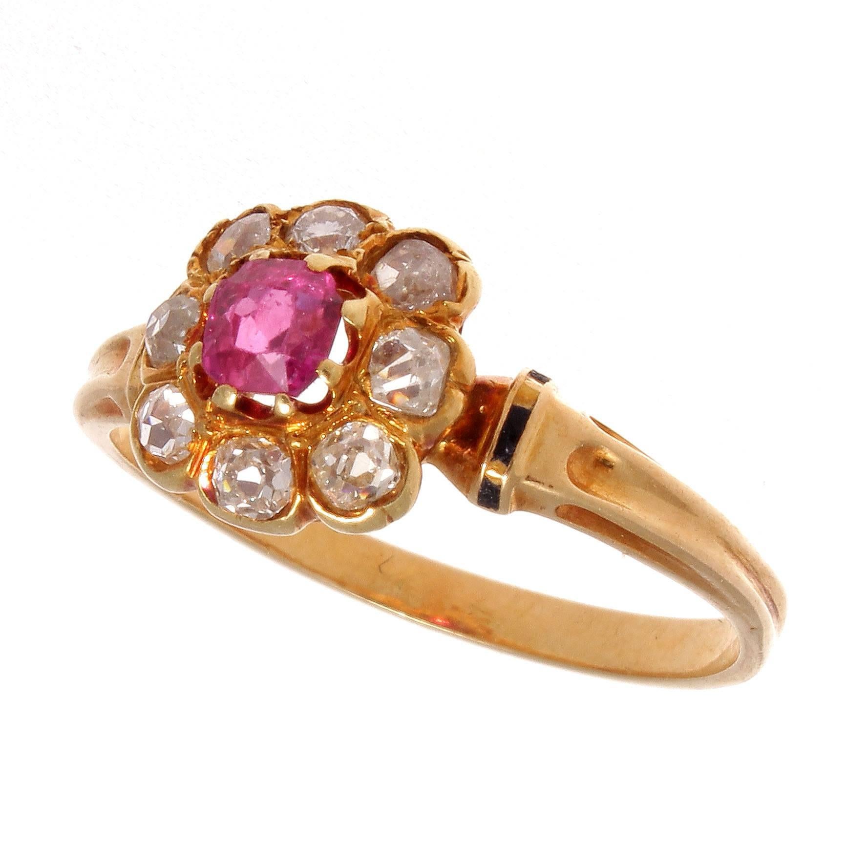 French designers have always been the architects of style and its easily displayed in this 19th century cluster ring. Influenced by the blossoming flowers of spring this ring explodes with bright colors. Featuring a vibrant red ruby center