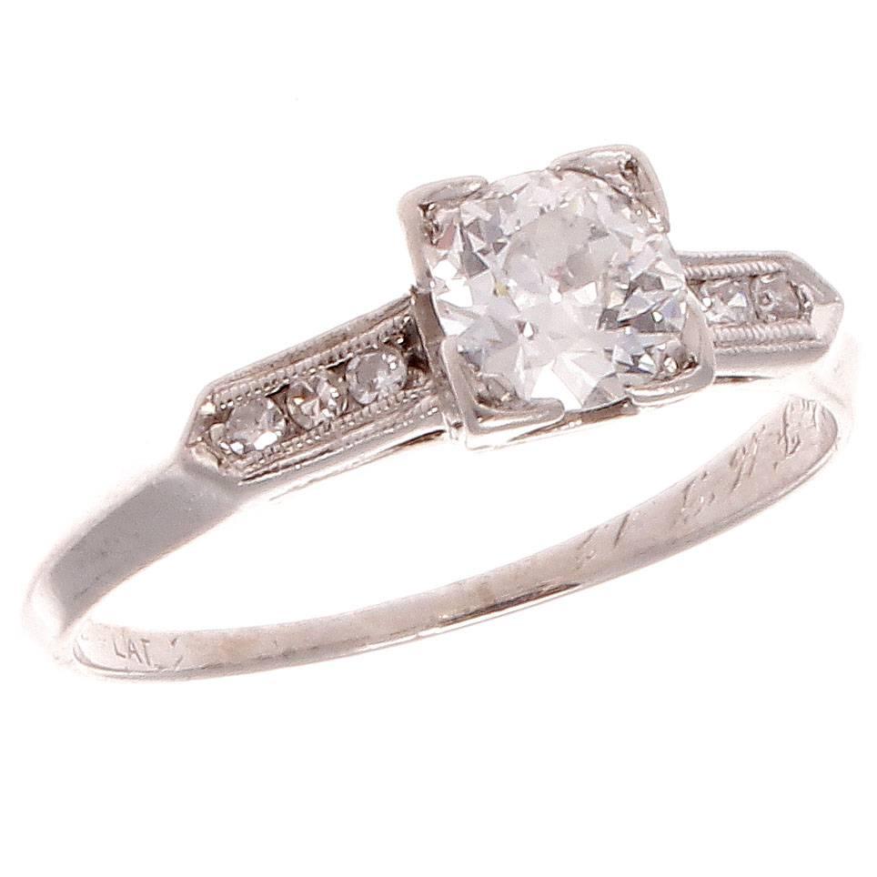 Love is expressed in many ways but tradition has made this the ultimate sentiment to say forever. Elegantly featuring an approximately 0.50 carat old European cut diamond that is classically accented by perfectly matching diamonds. Hand crafted in