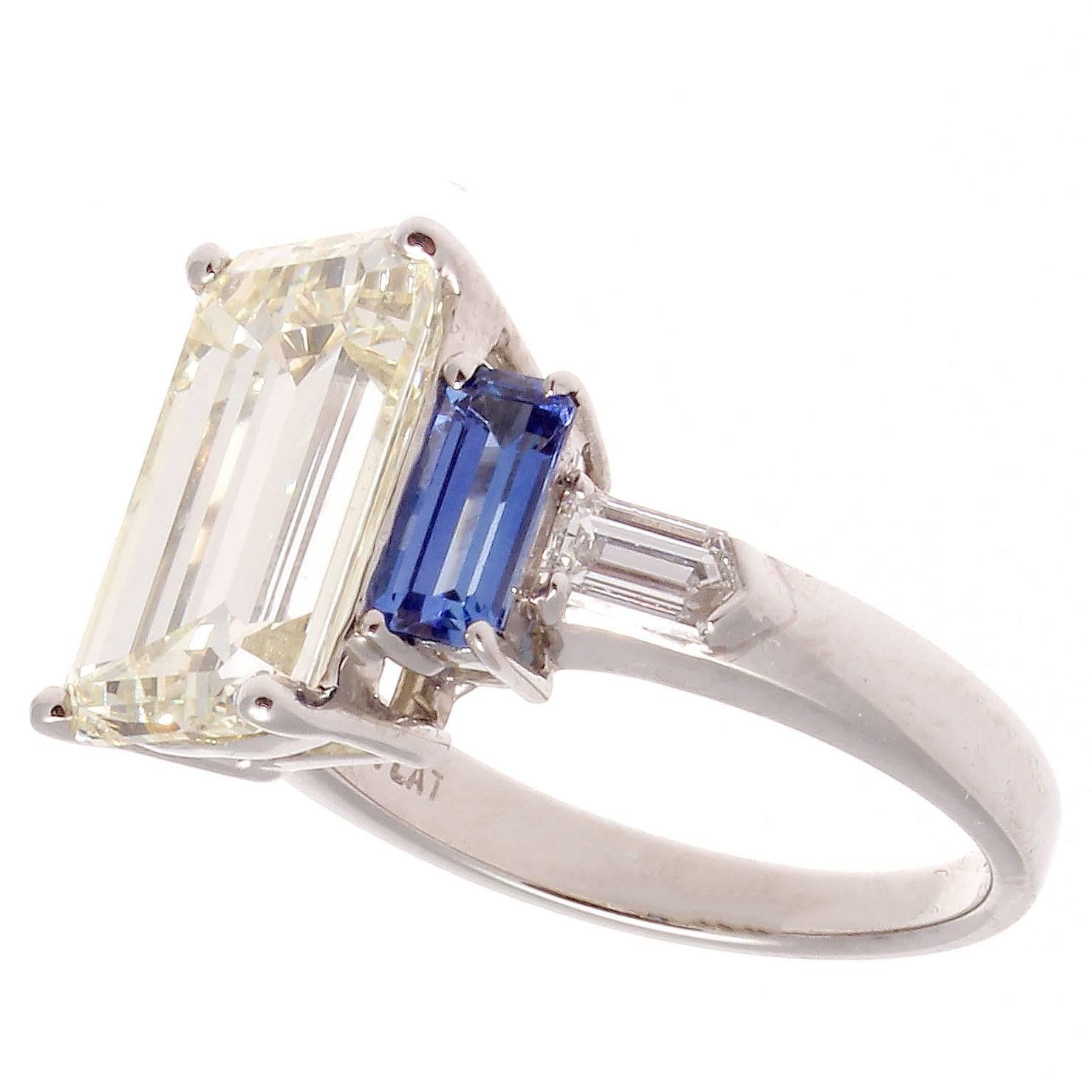  A modern twist on the traditional engagement ring. Displaying one of the most intriguing diamond cuts as it allows you to look deep into the stone and admire all its beauty. Featuring a rectangular 5.14 carat emerald cut diamond that is N-O color,