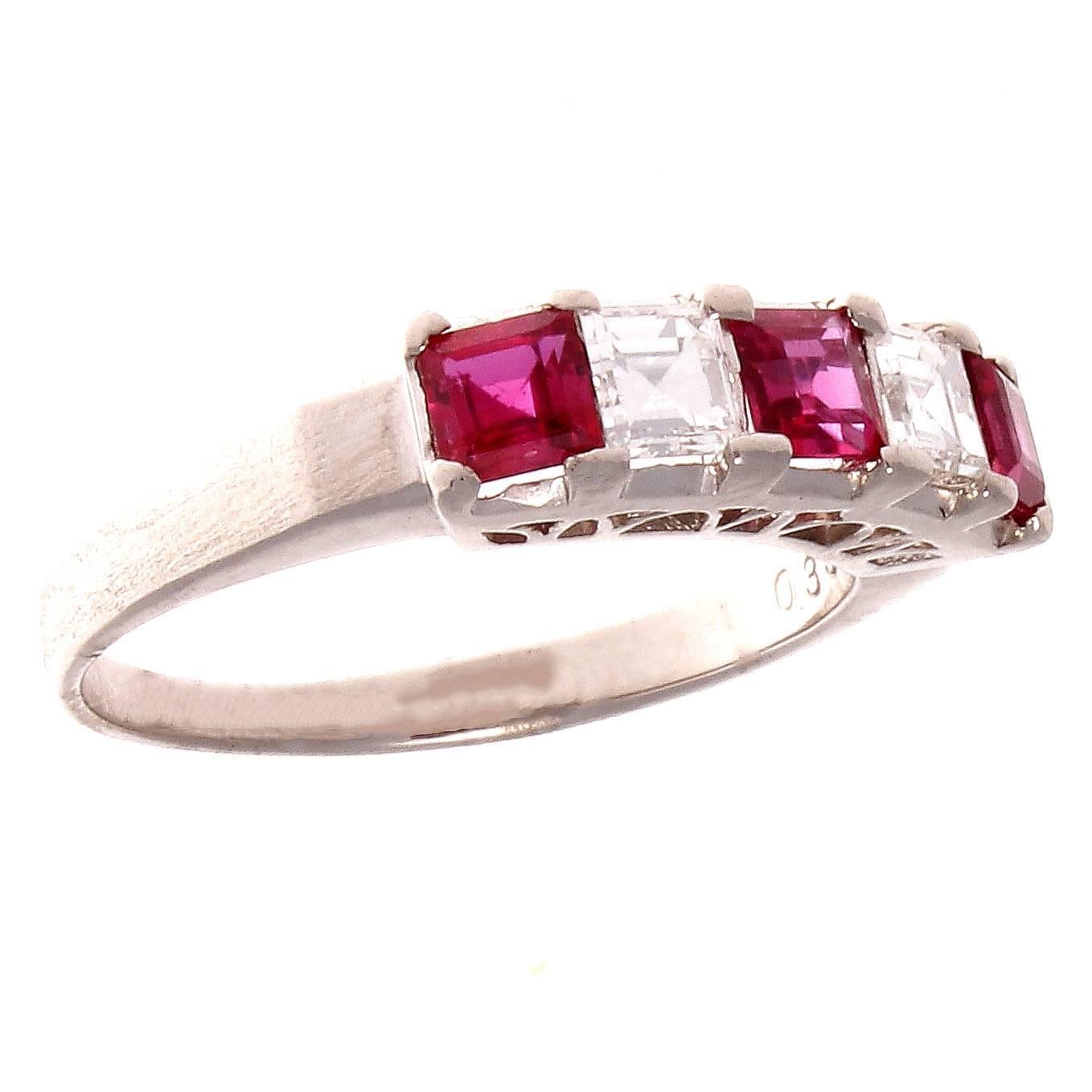 A modern creation of a classic beauty. A colorful mixture of vibrant red synthetic rubies that alternates with colorless white diamonds. Crafted in platinum.

Ring size 7 and may easily be resized to fit.